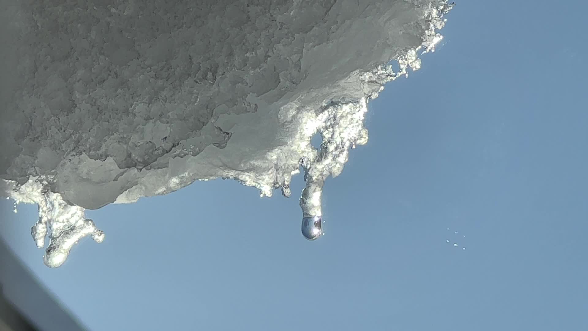 Snow and ice melting in the Winter sun