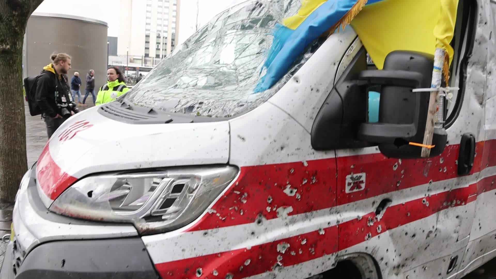 Damaged from artillery fire ambulance from Ukraine displayed in travel exhibition in Dutch cities - Tour de Ambulance