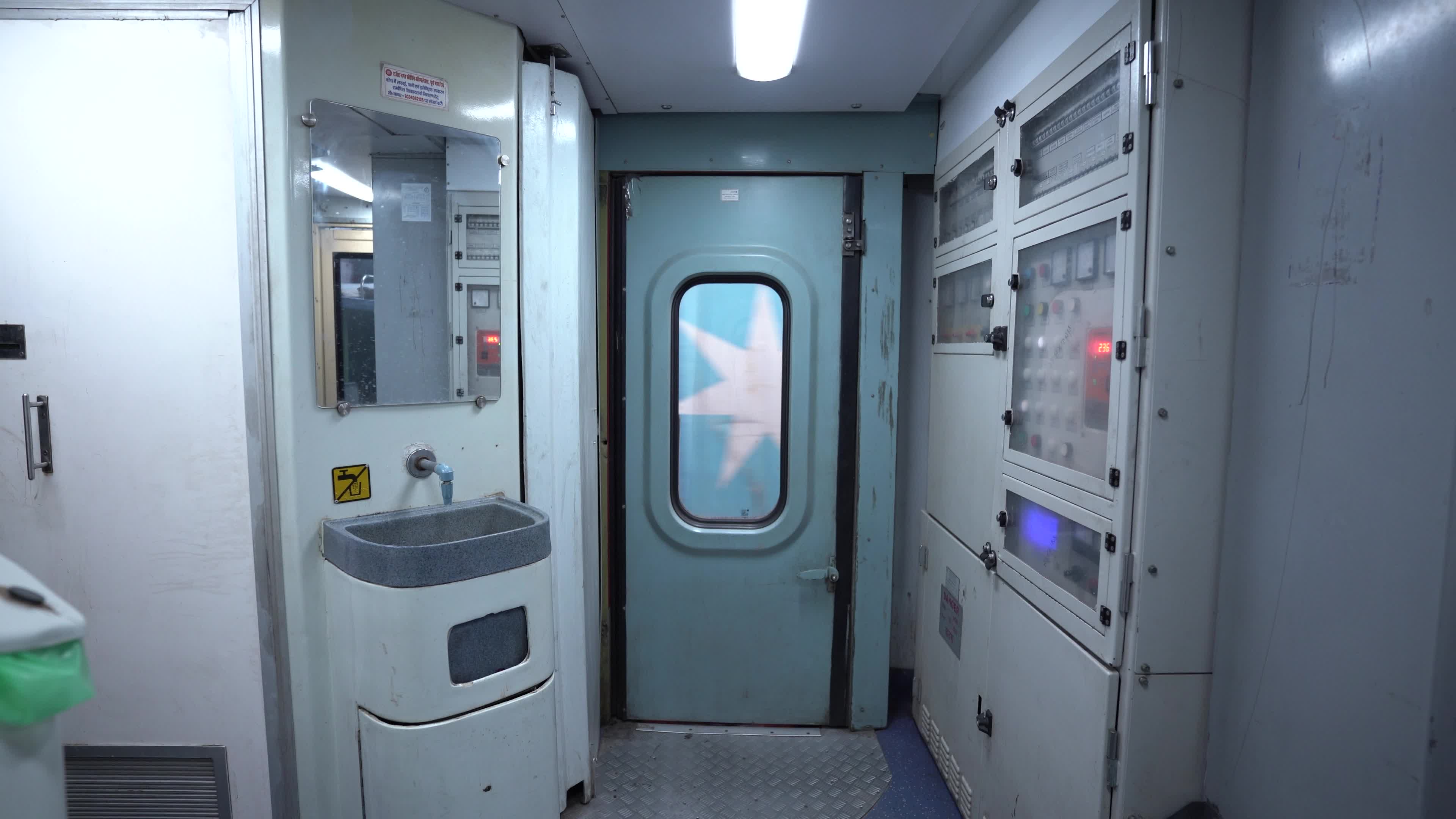 Wash basin & Electrical Connection area of a bogie of a passenger train of Indian Railways from Inside