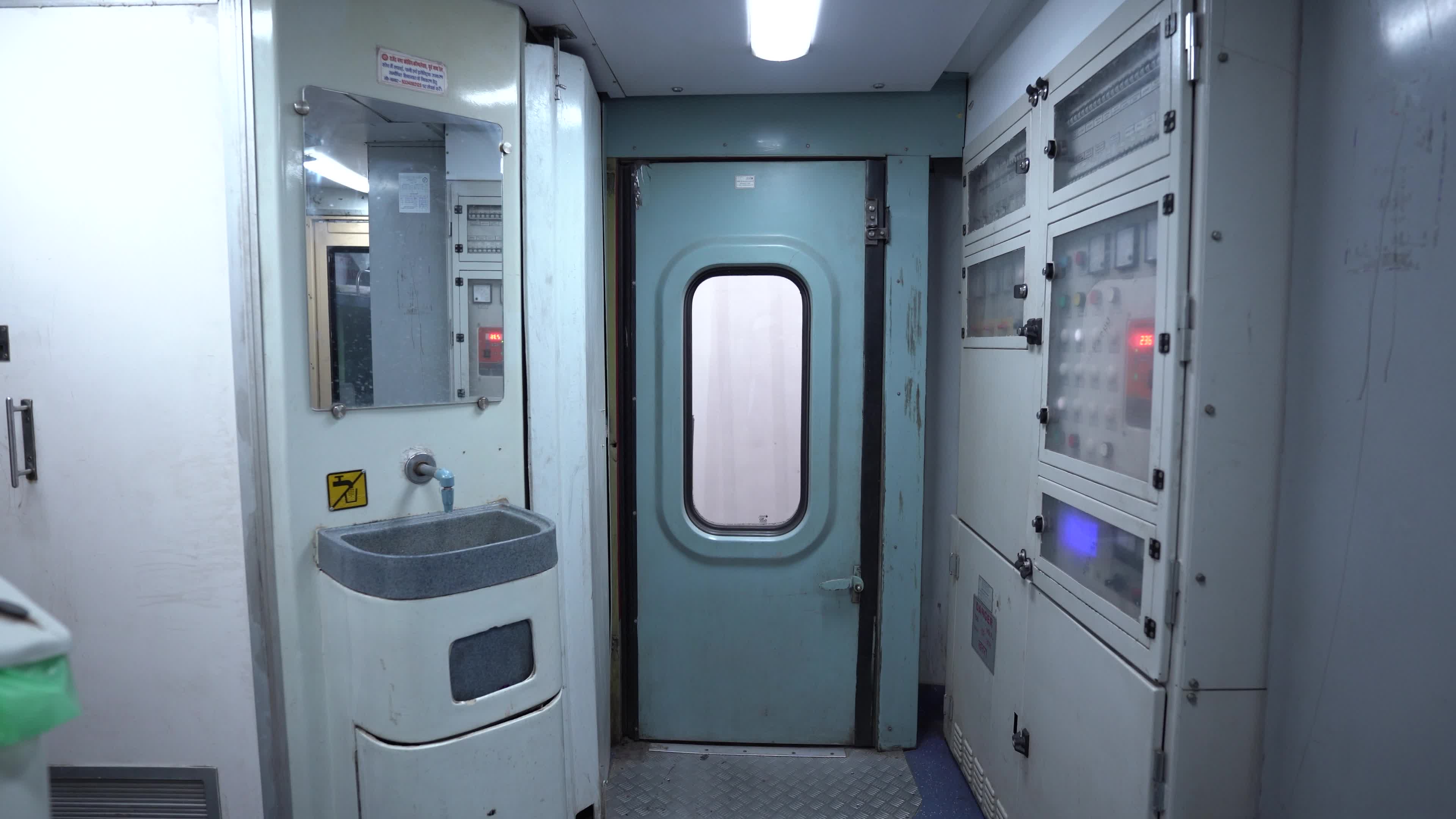 Wash basin & Electrical Connection area of a bogie of a passenger train of Indian Railways from Inside