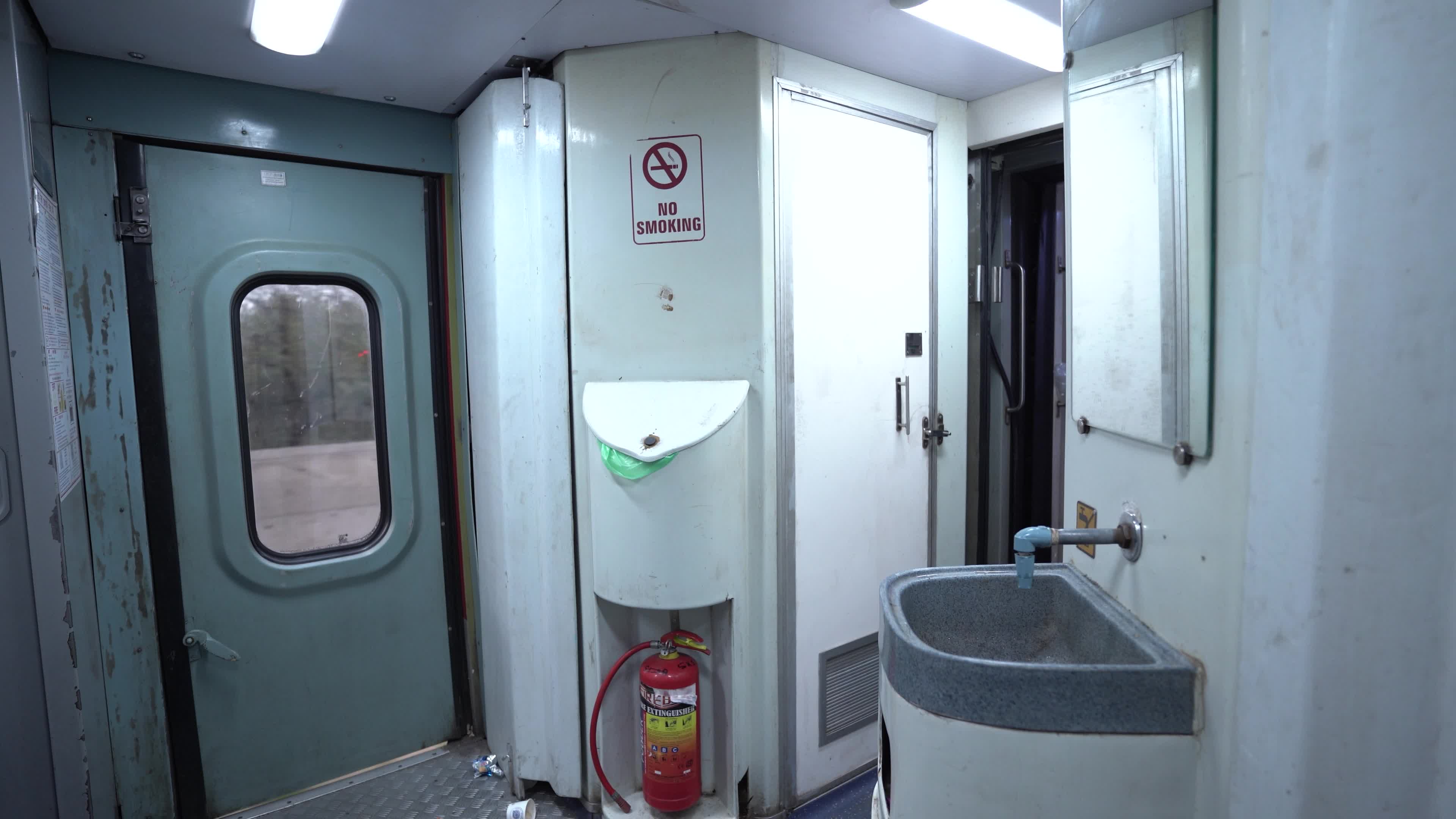 Wash basin & Electrical Connection area of a bogie of a passenger train of Indian Railways from Inside
