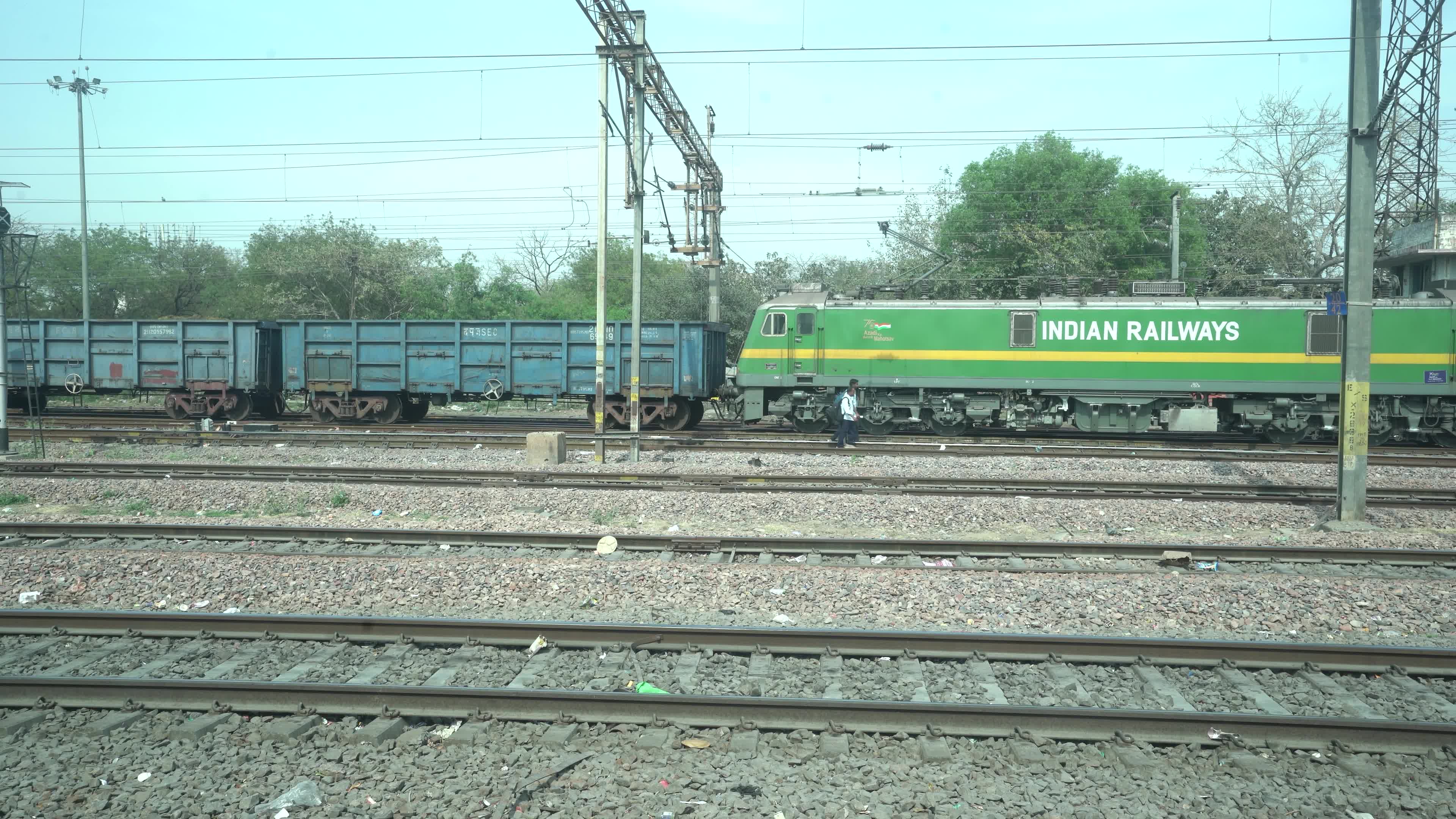 Views outside the window of a moving passenger train of Indian Railways in India