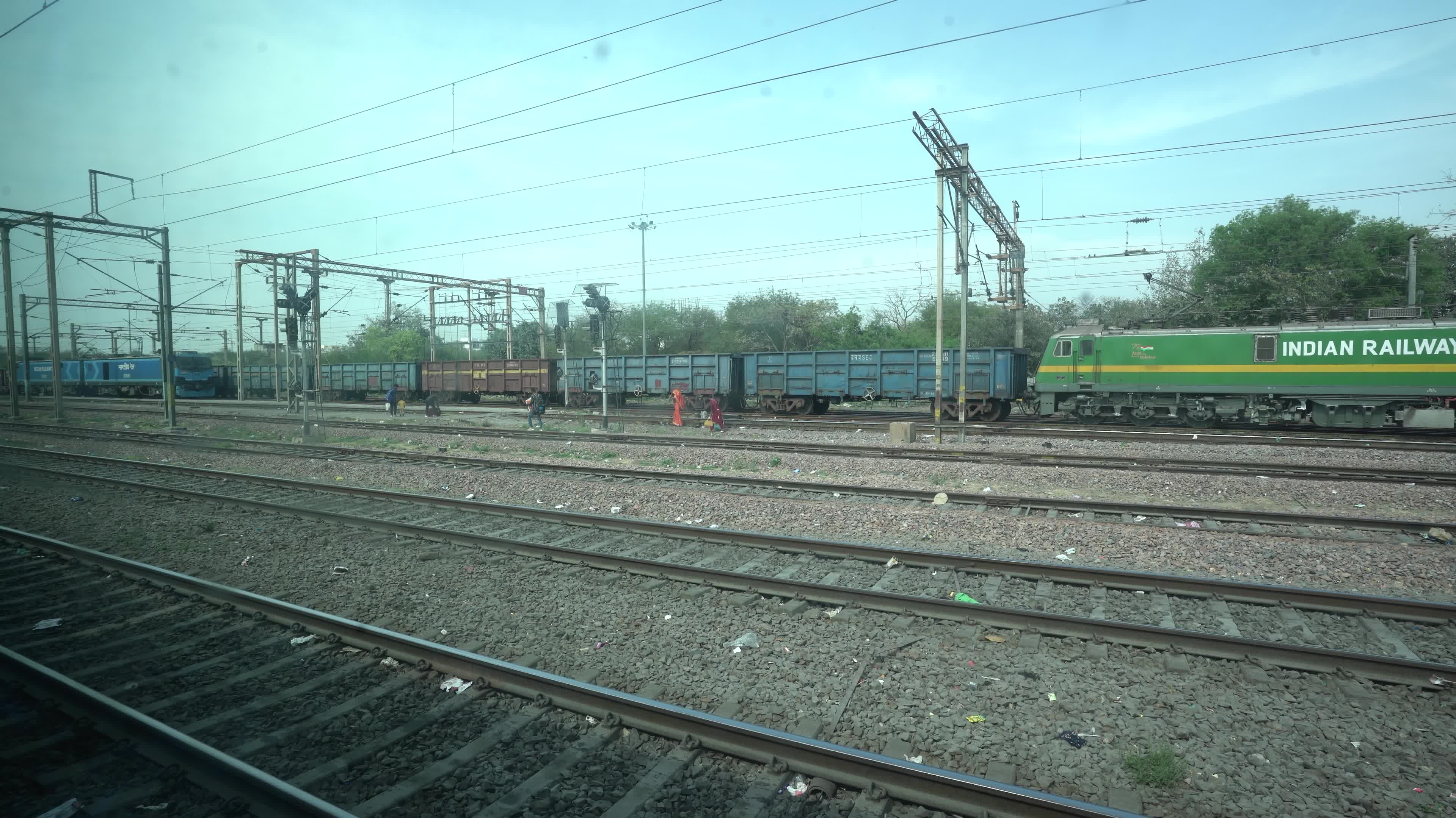Views outside the window of a moving passenger train of Indian Railways in India