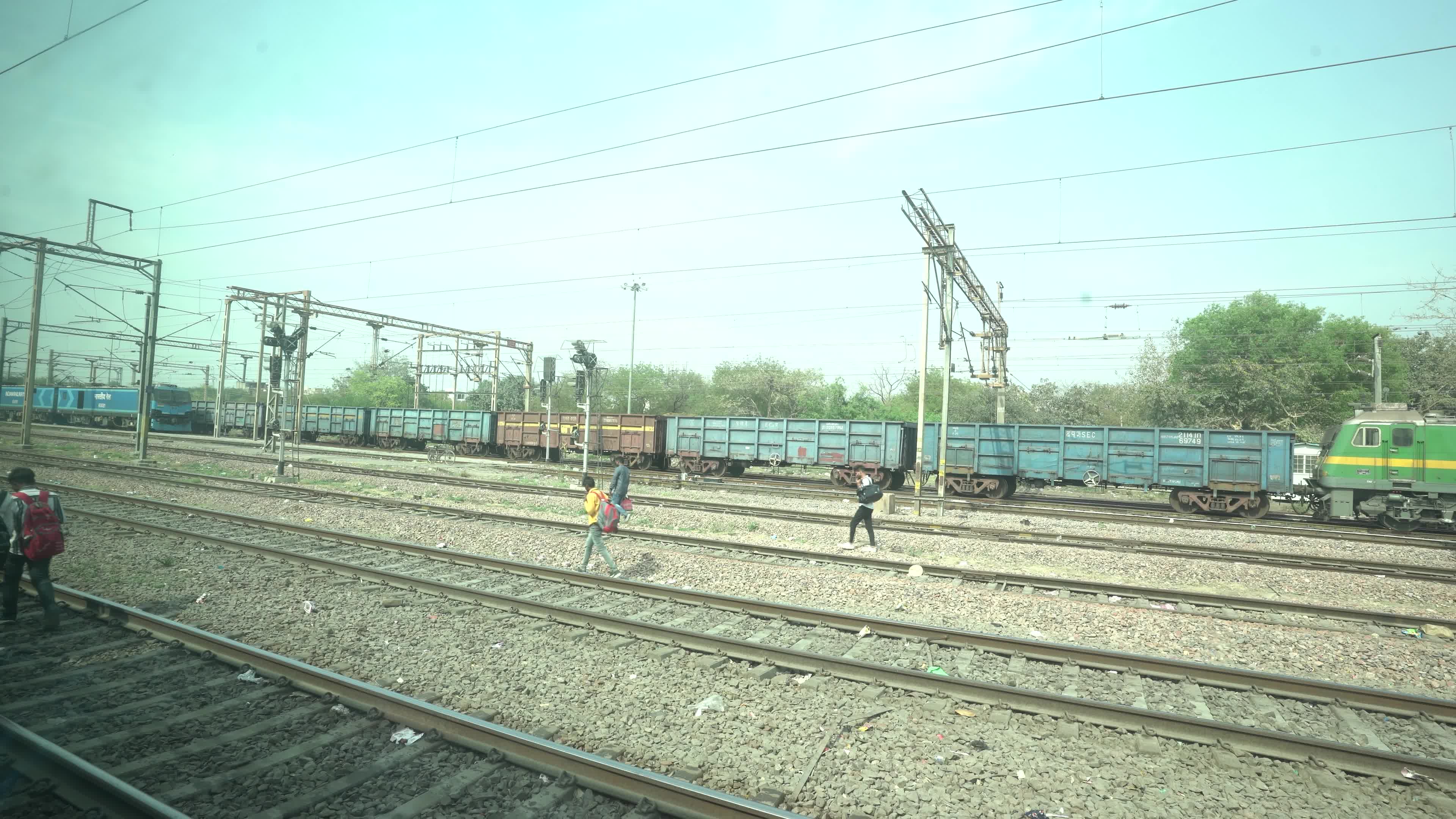 Views outside the window of a moving passenger train of Indian Railways in India