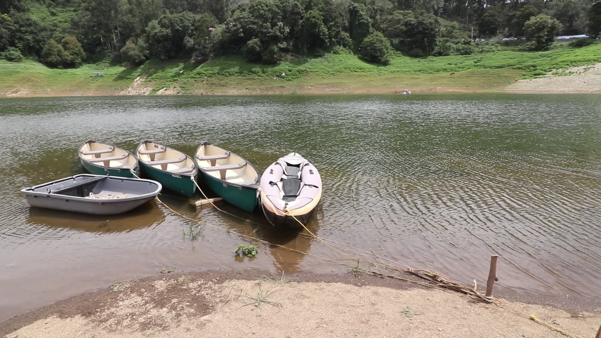 Kayak boats tied with ropes at Kundala Dam lake in Munnar, Kerala, India