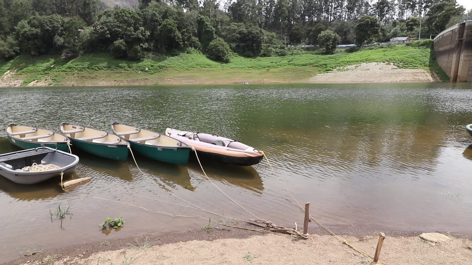 Kayak boats tied with ropes at Kundala Dam lake in Munnar, Kerala, India