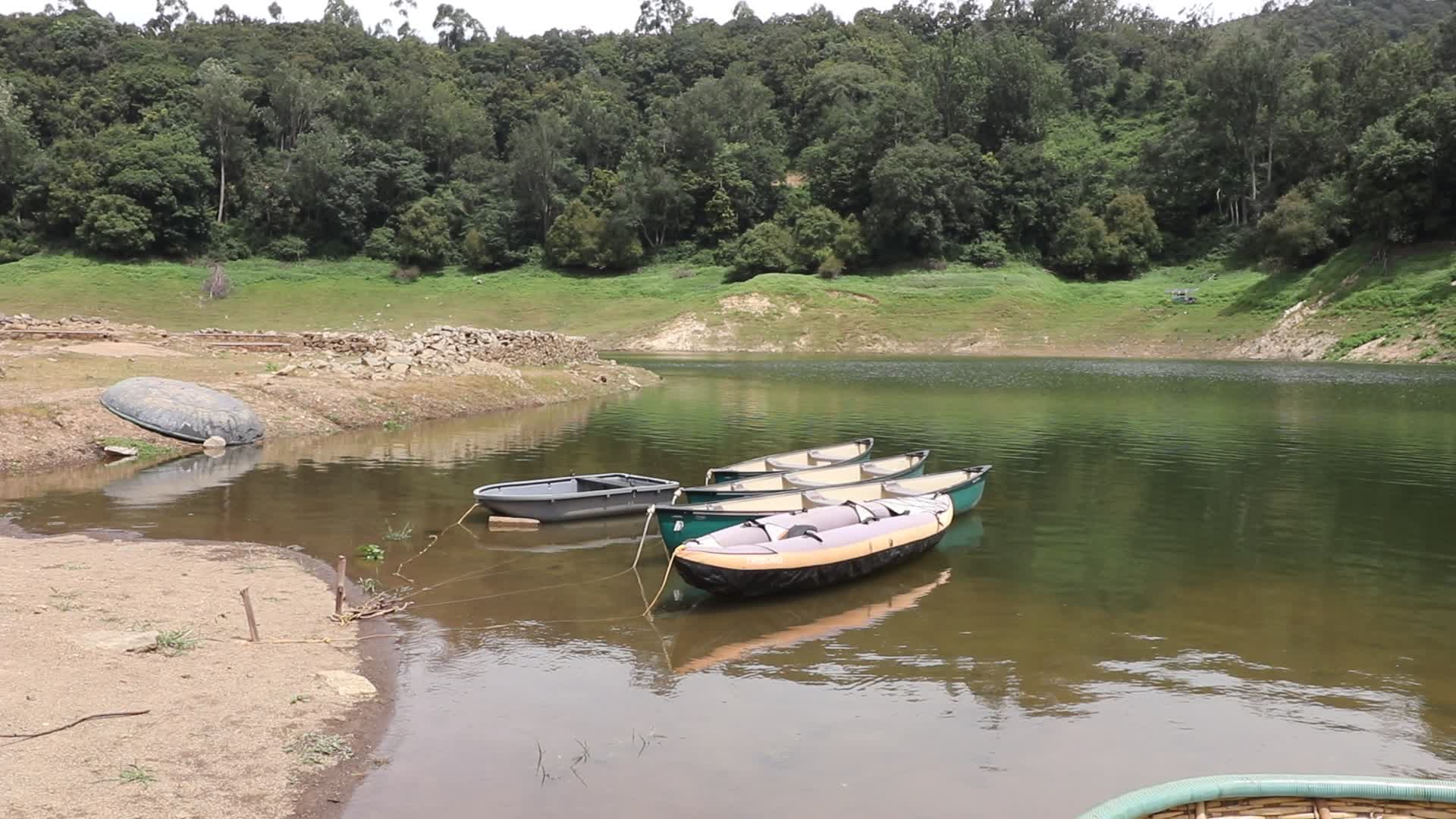 Kayak boats tied with ropes at Kundala Dam lake in Munnar, Kerala, India