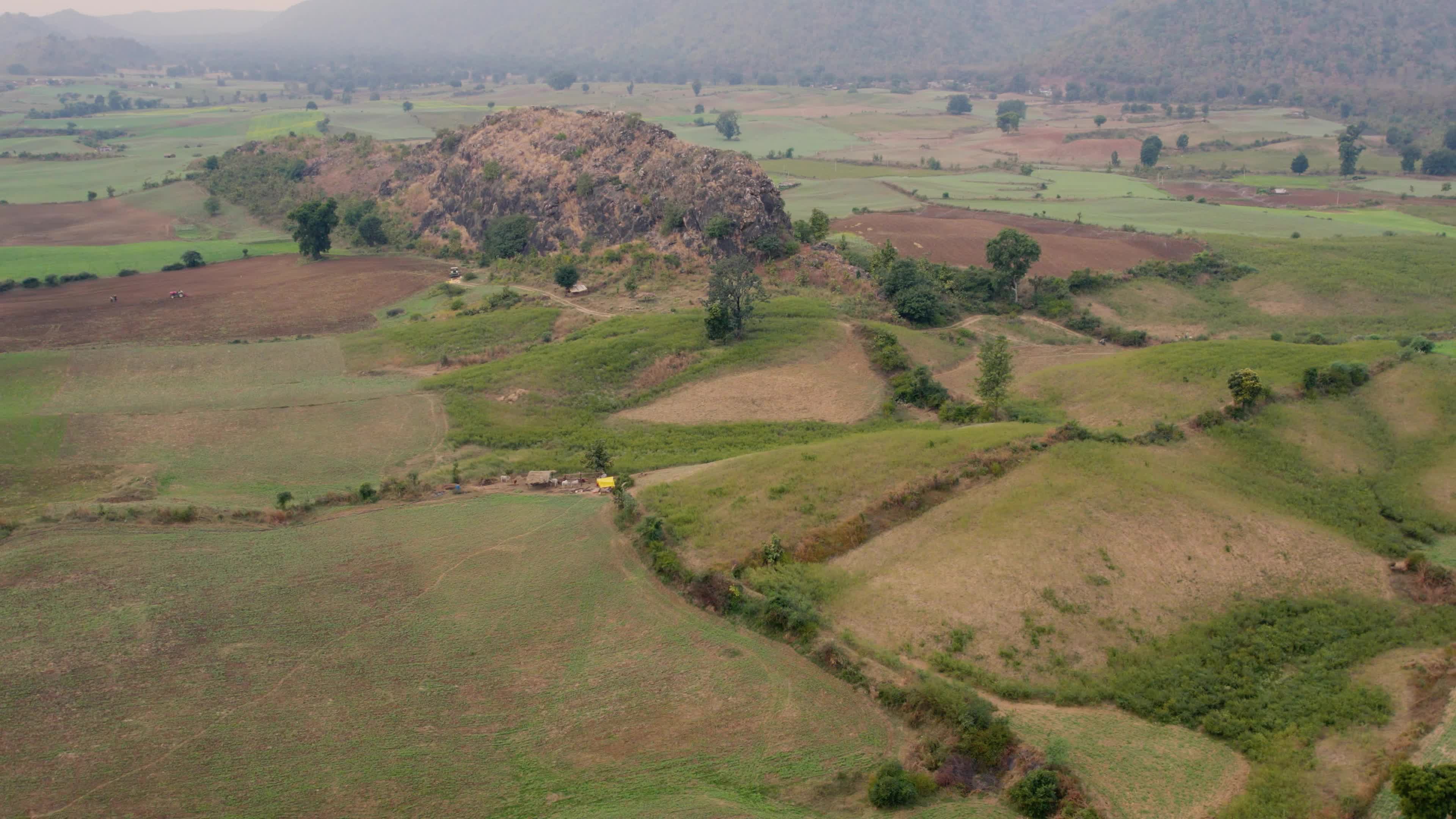 Beautiful drone view of a River surrounded by mountains and fields in the Indian state of Chhattisgarh