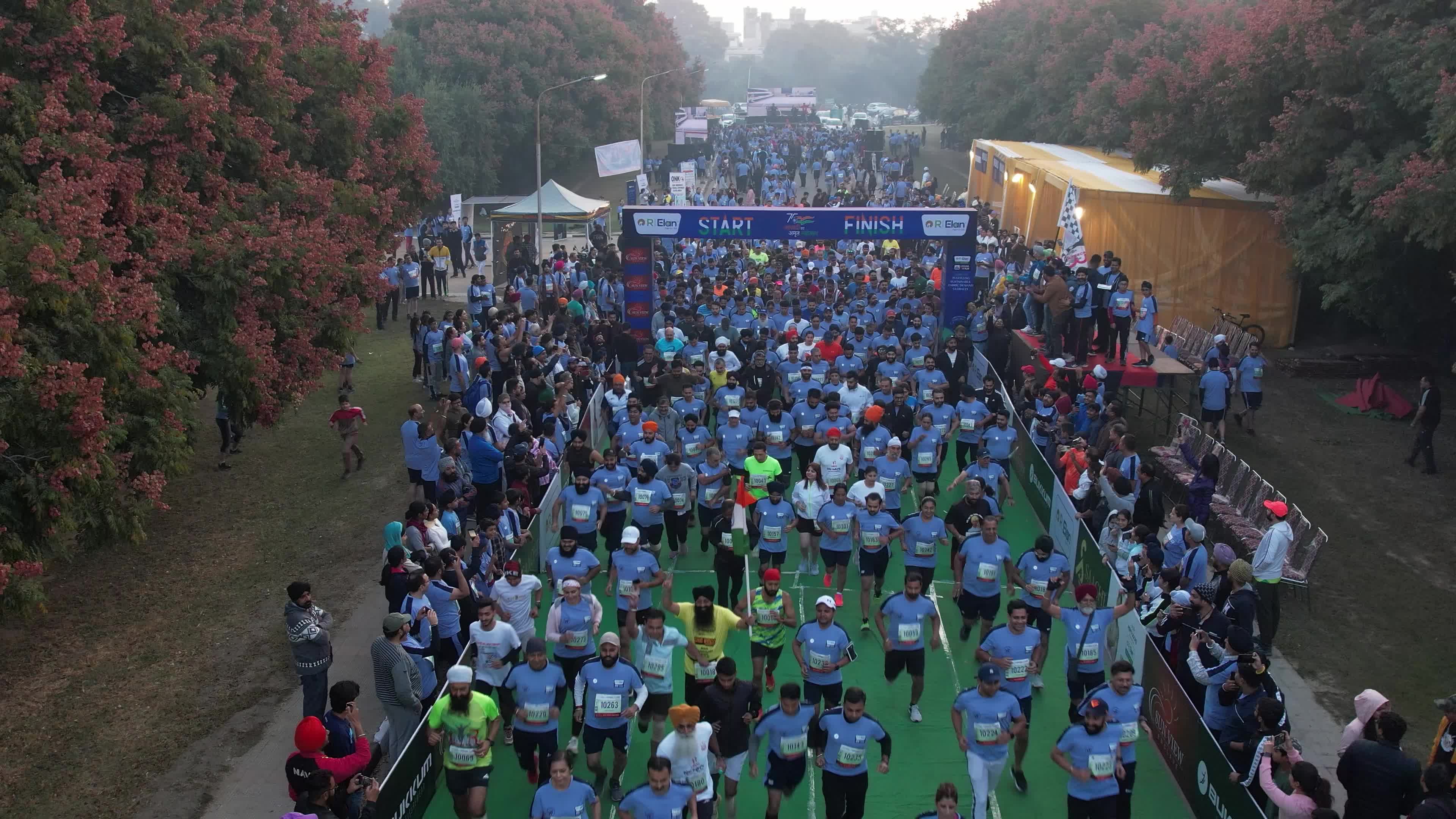 Red Flower Lined Roads and Endless Runners: Ludhiana Marathon 4K Drone Video