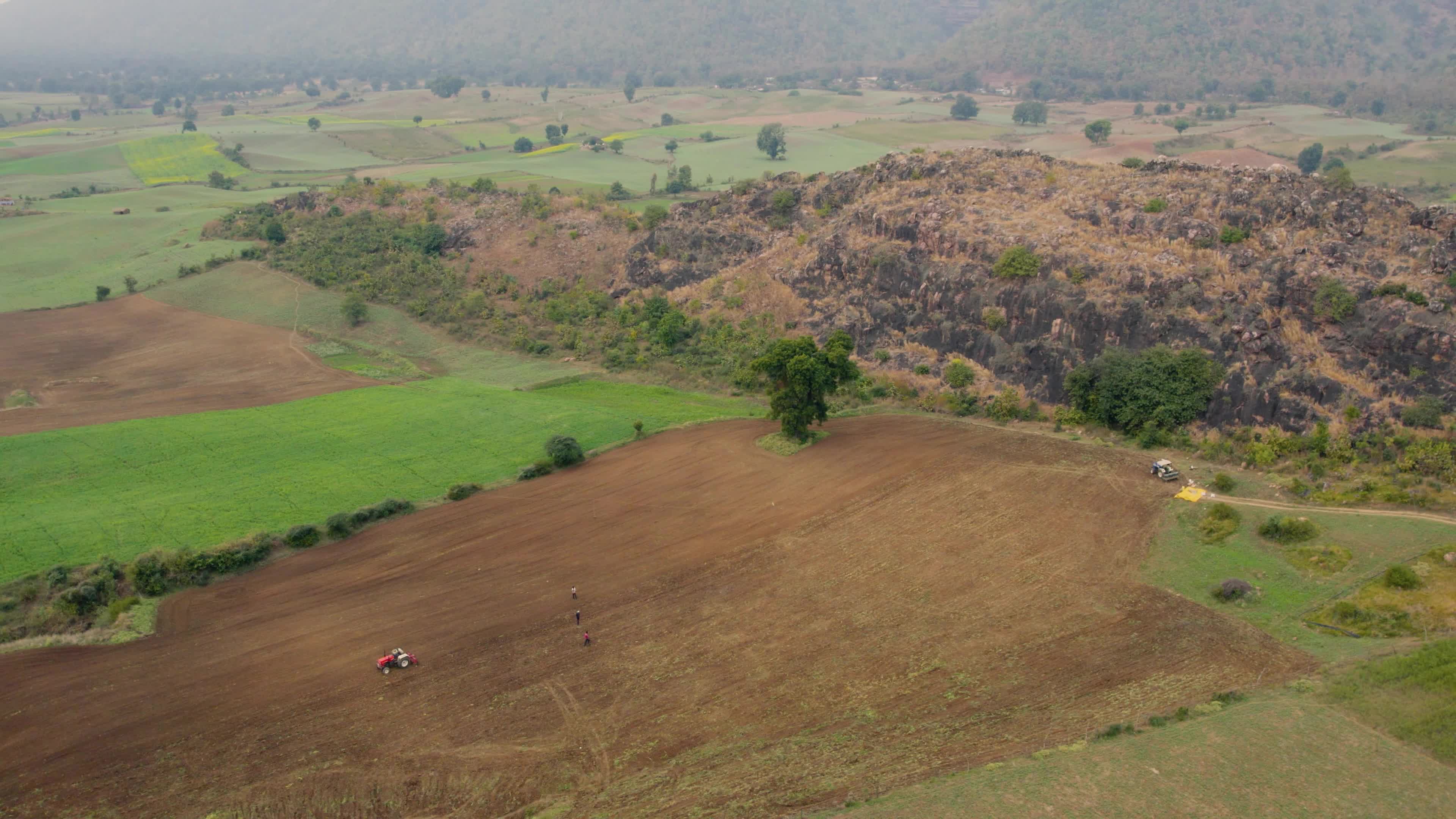 Beautiful drone view of a River surrounded by mountains and fields in the Indian state of Chhattisgarh