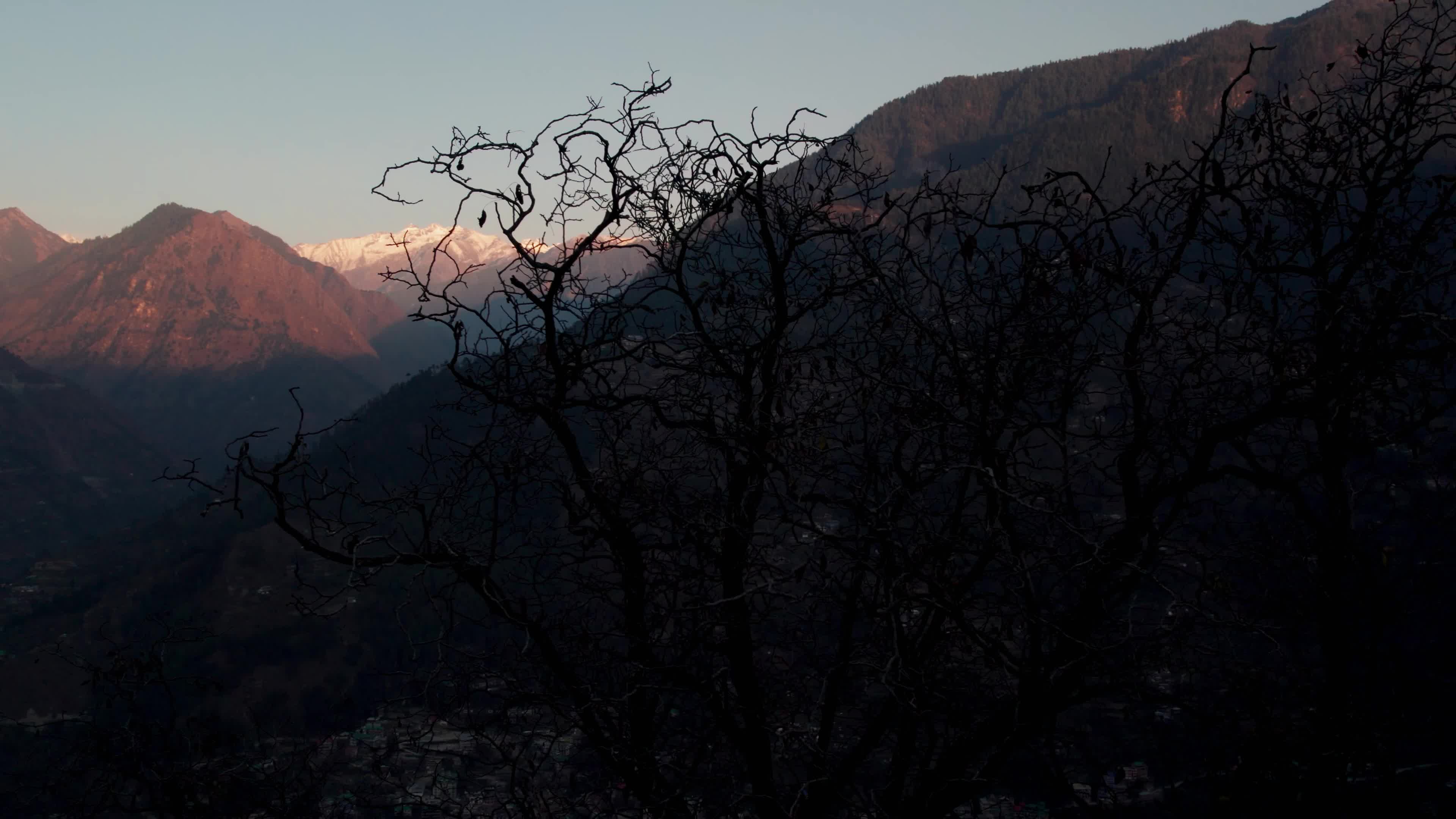 Aerial 4K Drone Footage of Breathtaking Sunset in Himachal Pradesh - Heaven-Like View of Snowcapped Peaks and Tirthan Valley