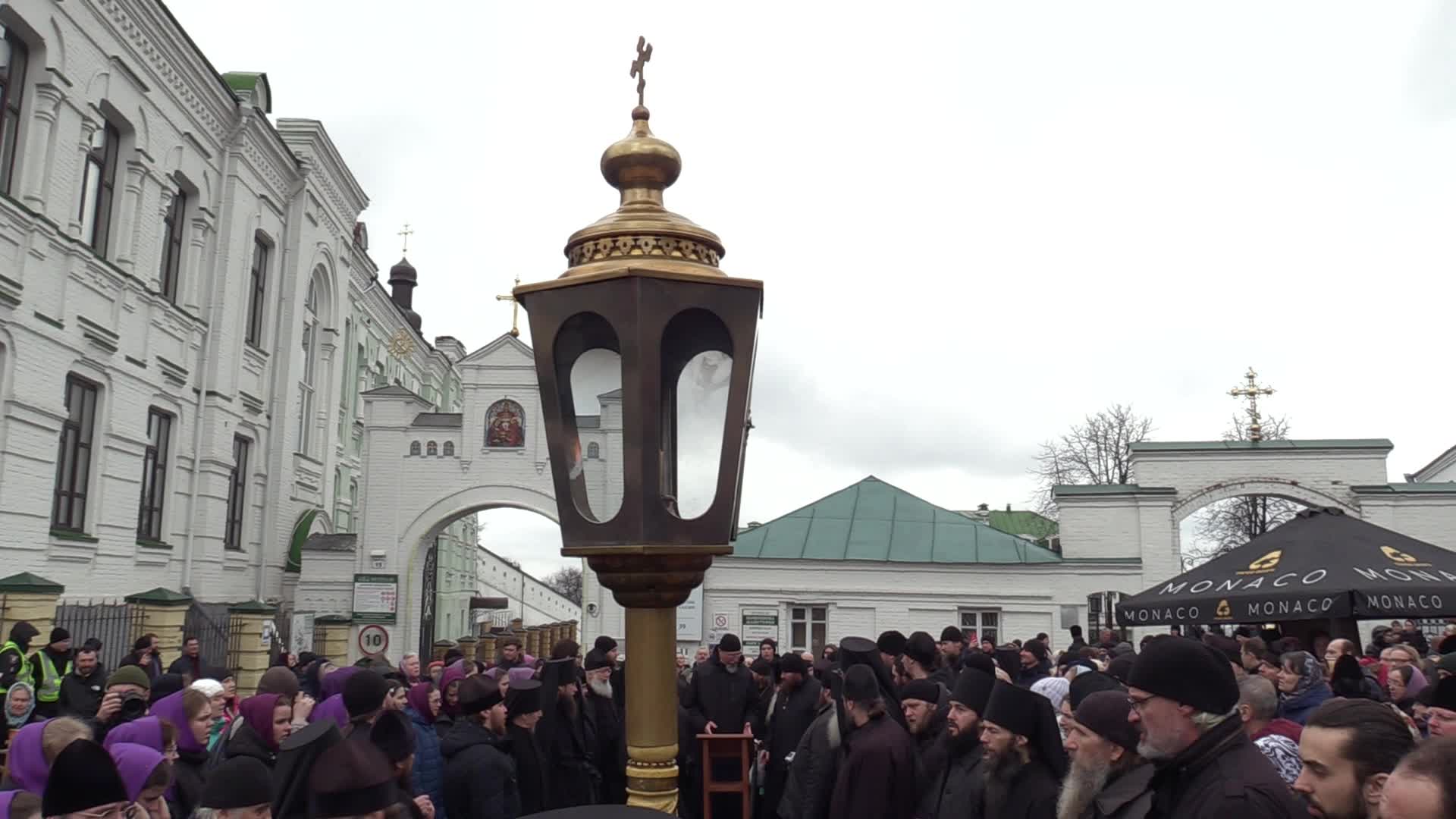 Believers pray and block the acess at an entry to Kyiv-Pechersk Lavra despite lease agreement expired, amid Russia's invasion of Ukraine