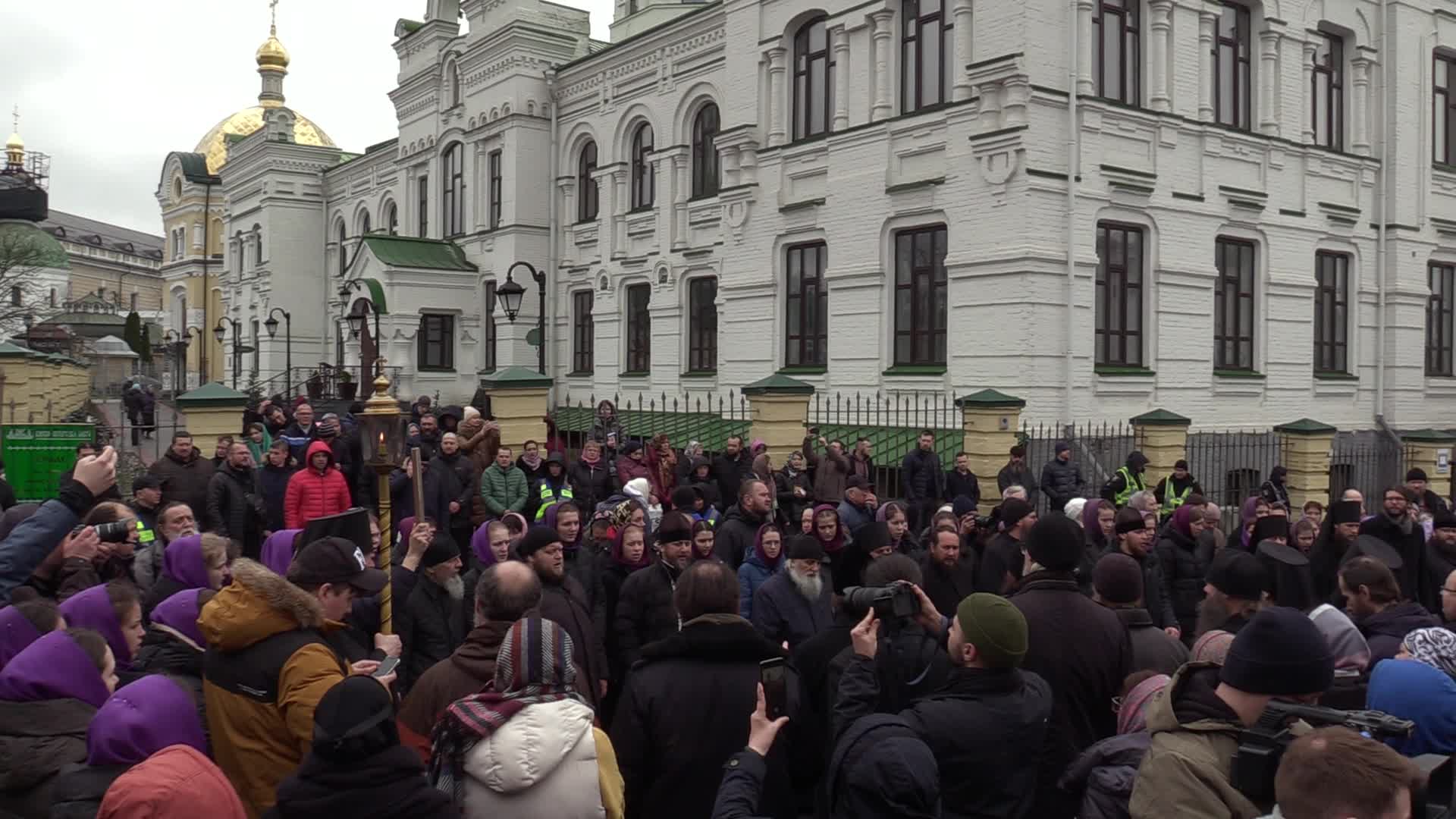 Believers pray and block the acess at an entry to Kyiv-Pechersk Lavra despite lease agreement expired, amid Russia's invasion of Ukraine