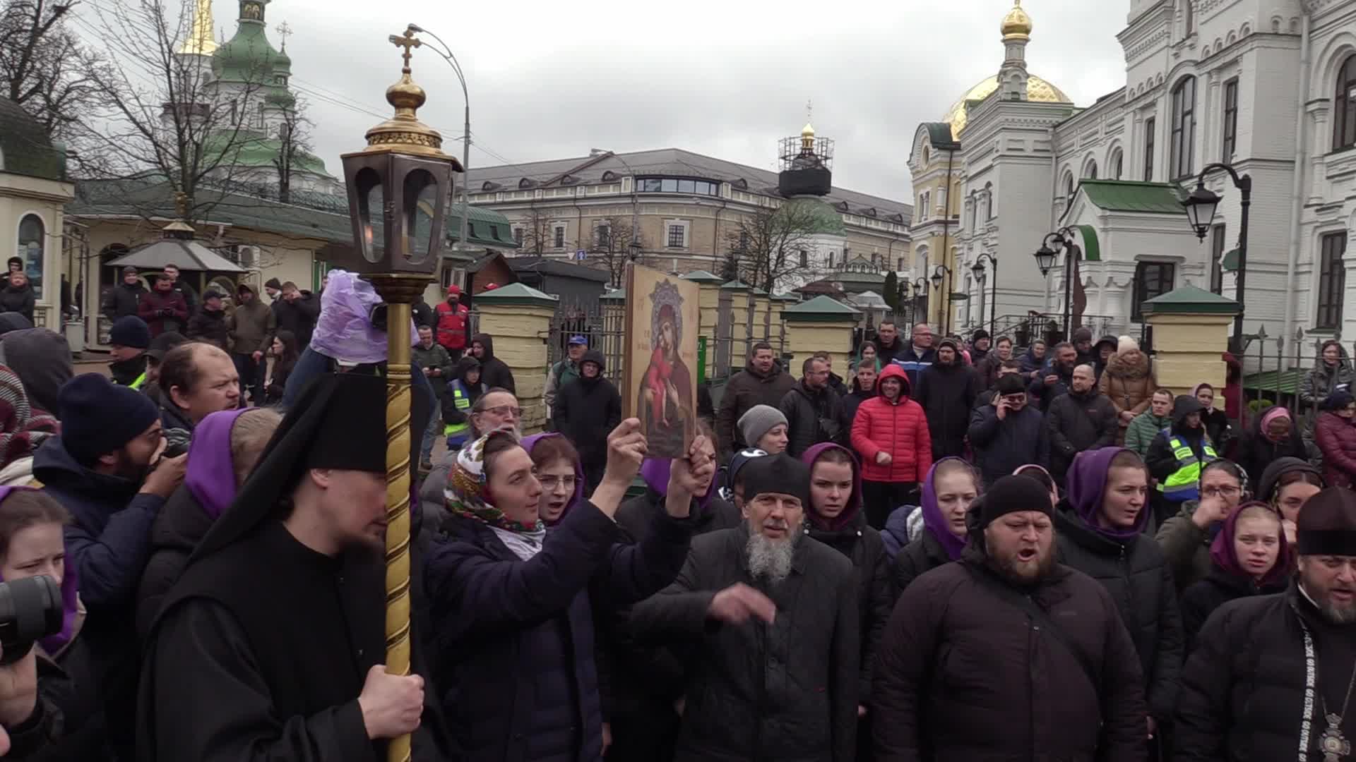 Believers pray and block the acess at an entry to Kyiv-Pechersk Lavra despite lease agreement expired, amid Russia's invasion of Ukraine