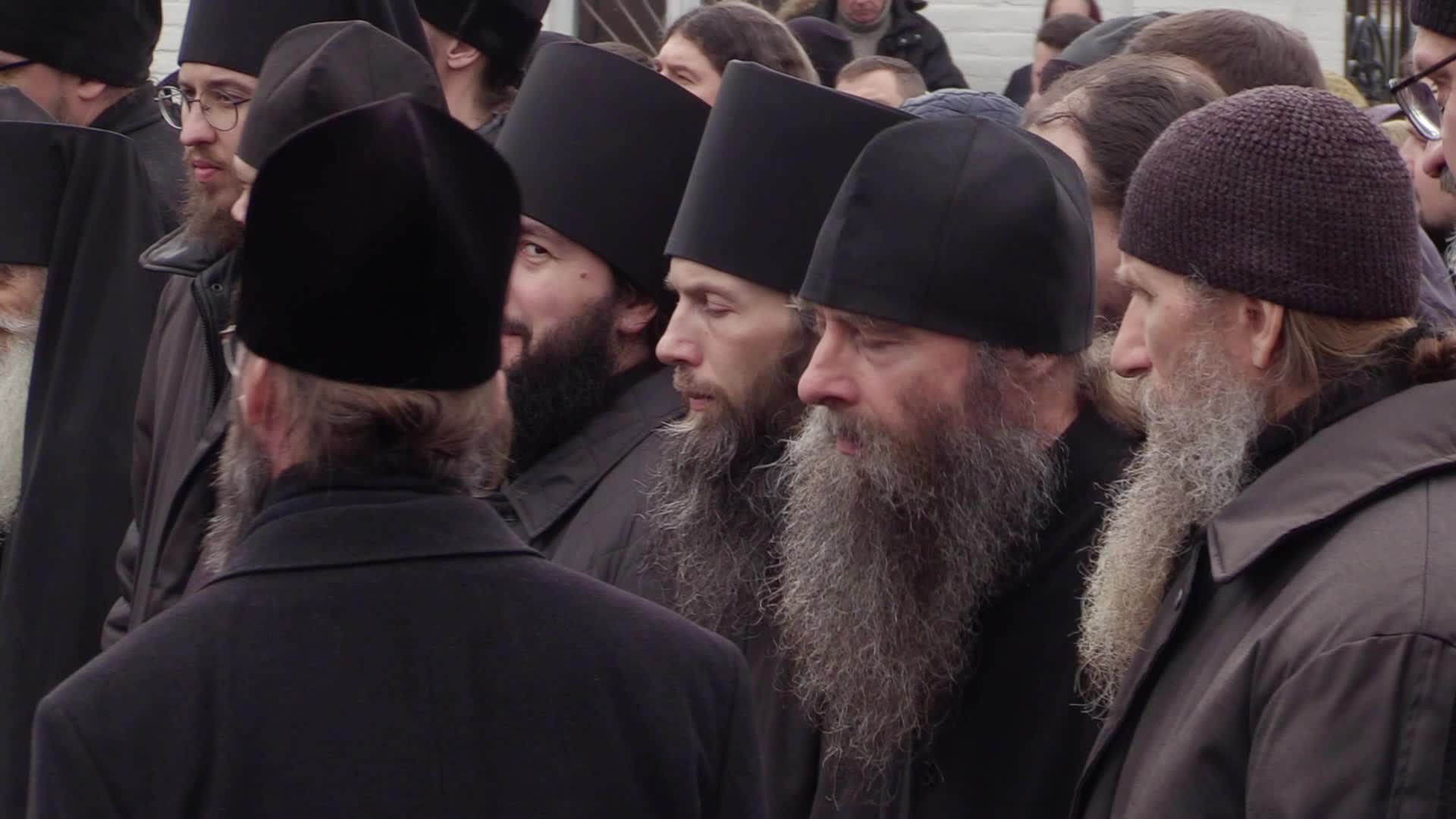 Believers pray and block the acess at an entry to Kyiv-Pechersk Lavra despite lease agreement expired, amid Russia's invasion of Ukraine