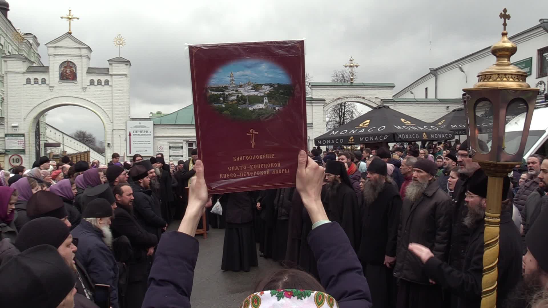 Believers pray and block the acess at an entry to Kyiv-Pechersk Lavra despite lease agreement expired, amid Russia's invasion of Ukraine