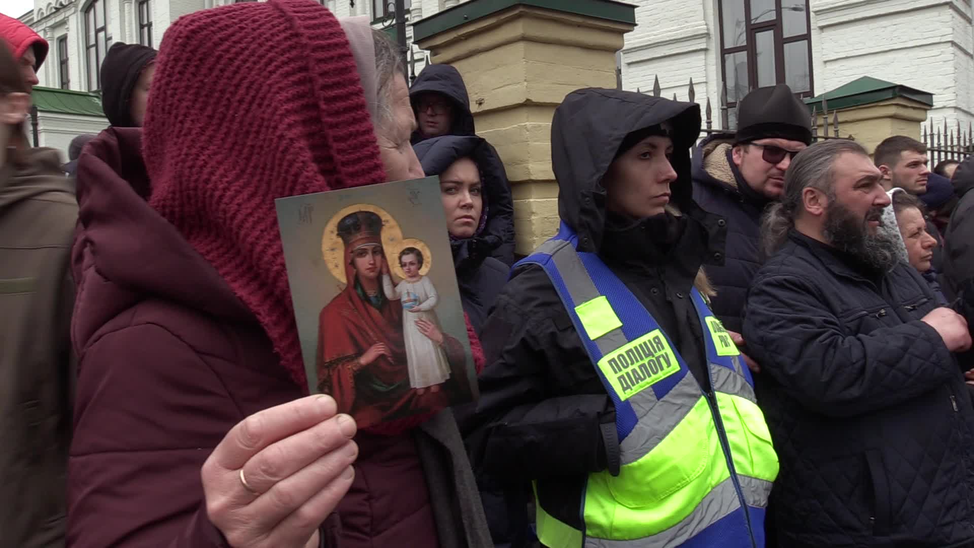 Believers pray and block the acess at an entry to Kyiv-Pechersk Lavra despite lease agreement expired, amid Russia's invasion of Ukraine