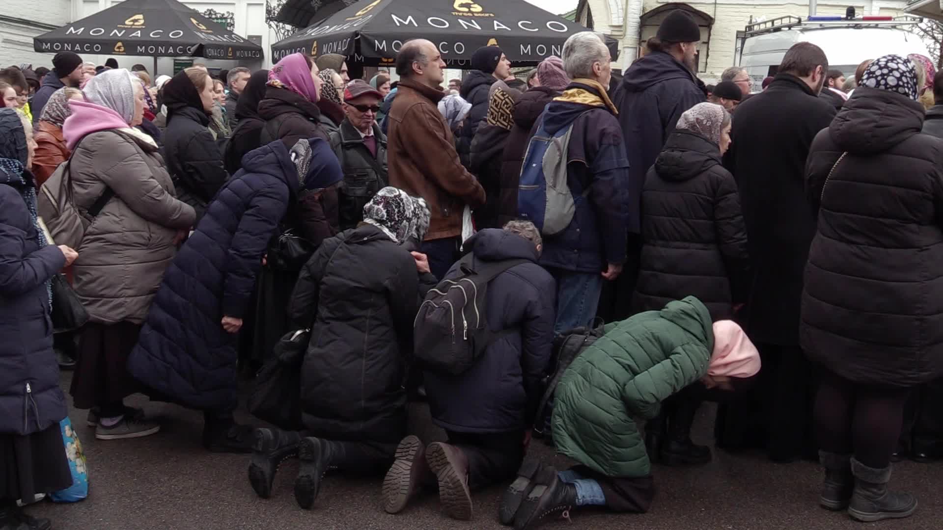 Believers pray and block the acess at an entry to Kyiv-Pechersk Lavra despite lease agreement expired, amid Russia's invasion of Ukraine