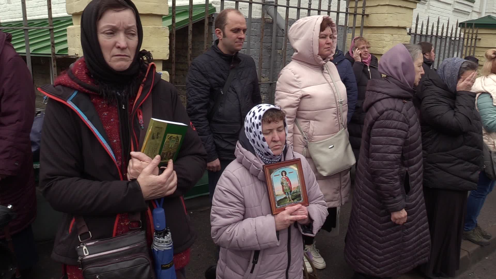 Believers pray and block the acess at an entry to Kyiv-Pechersk Lavra despite lease agreement expired, amid Russia's invasion of Ukraine
