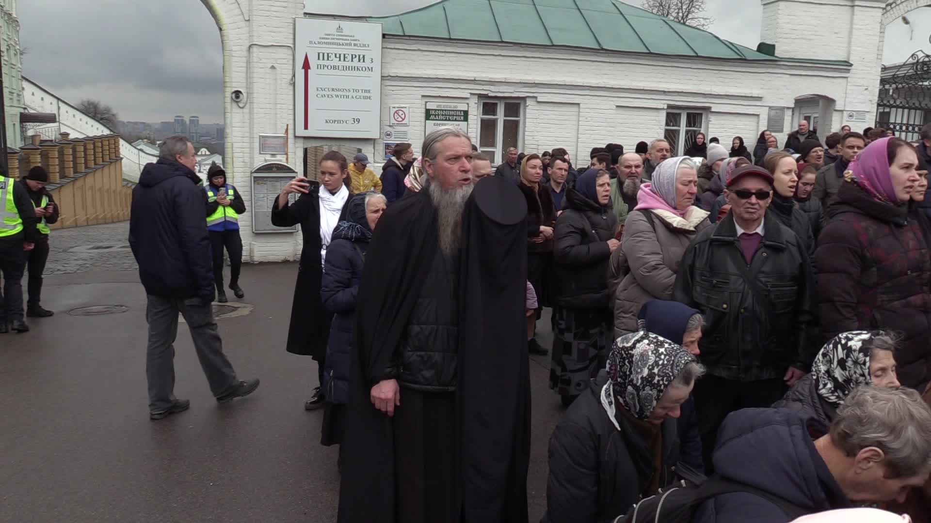 Believers pray and block the acess at an entry to Kyiv-Pechersk Lavra despite lease agreement expired, amid Russia's invasion of Ukraine