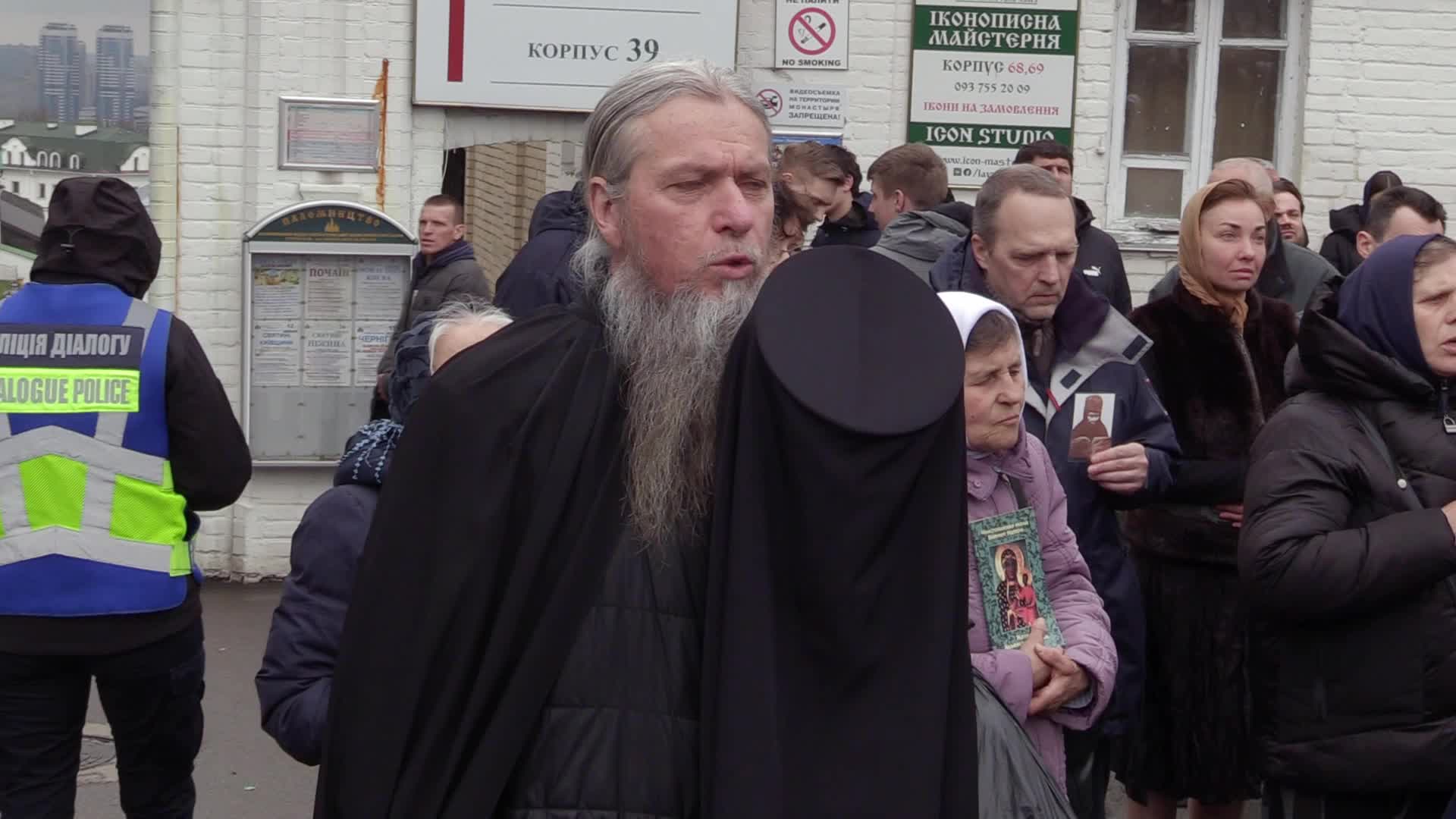 Believers pray and block the acess at an entry to Kyiv-Pechersk Lavra despite lease agreement expired, amid Russia's invasion of Ukraine