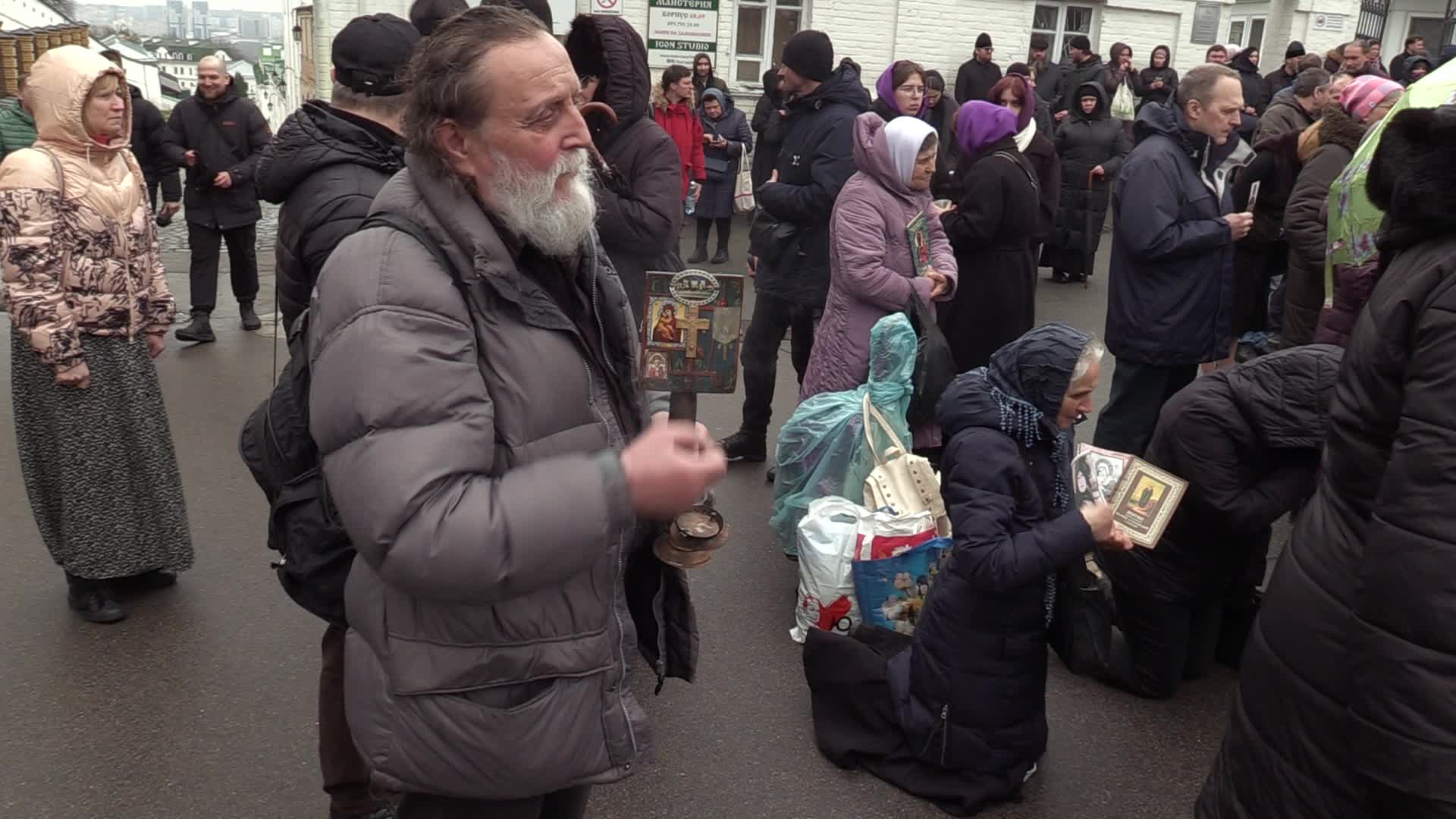 Believers pray and block the acess at an entry to Kyiv-Pechersk Lavra despite lease agreement expired, amid Russia's invasion of Ukraine