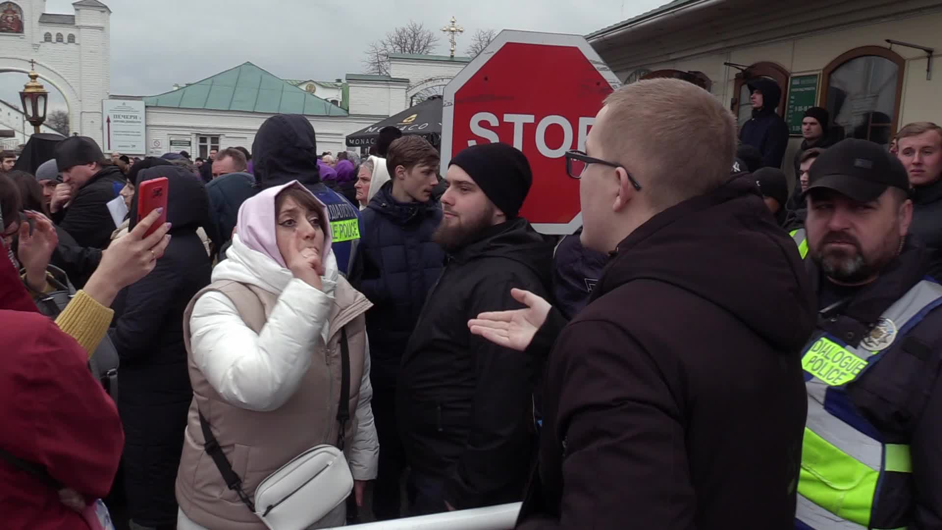 Believers pray and block the acess at an entry to Kyiv-Pechersk Lavra despite lease agreement expired, amid Russia's invasion of Ukraine