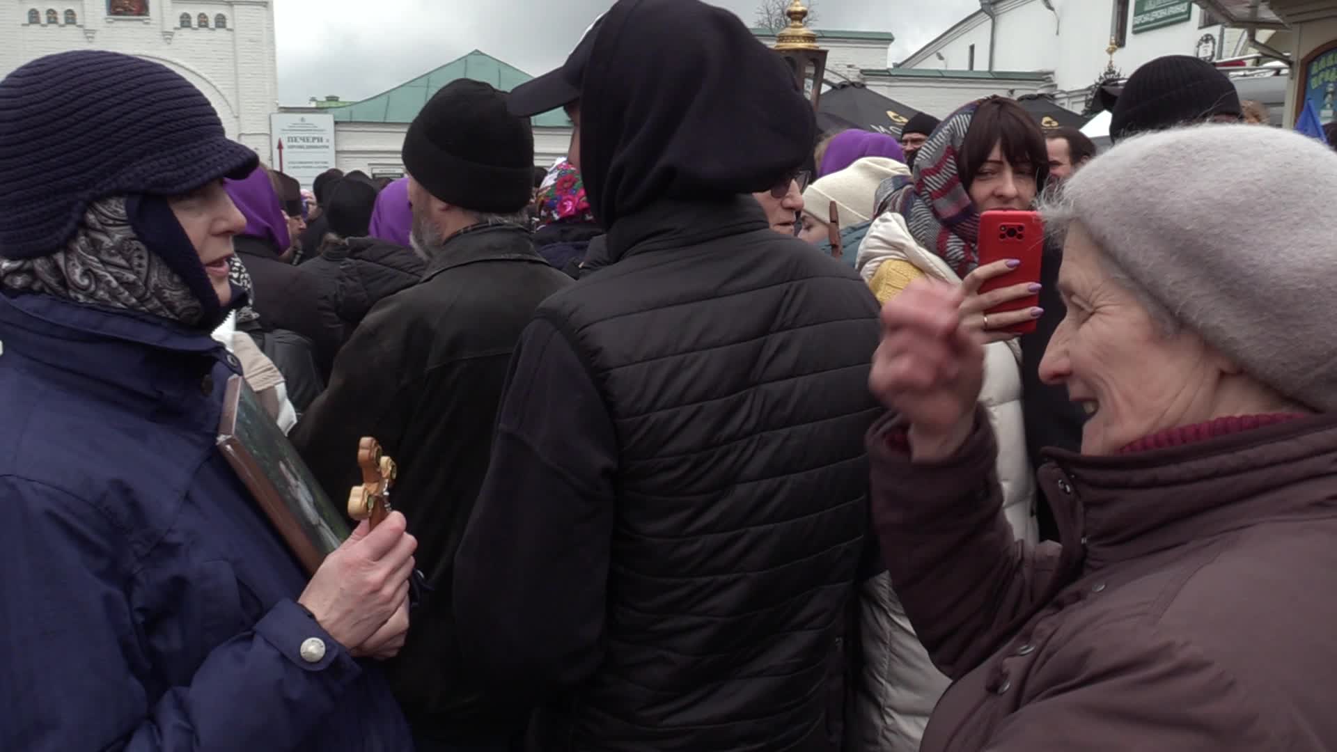 Believers pray and block the acess at an entry to Kyiv-Pechersk Lavra despite lease agreement expired, amid Russia's invasion of Ukraine