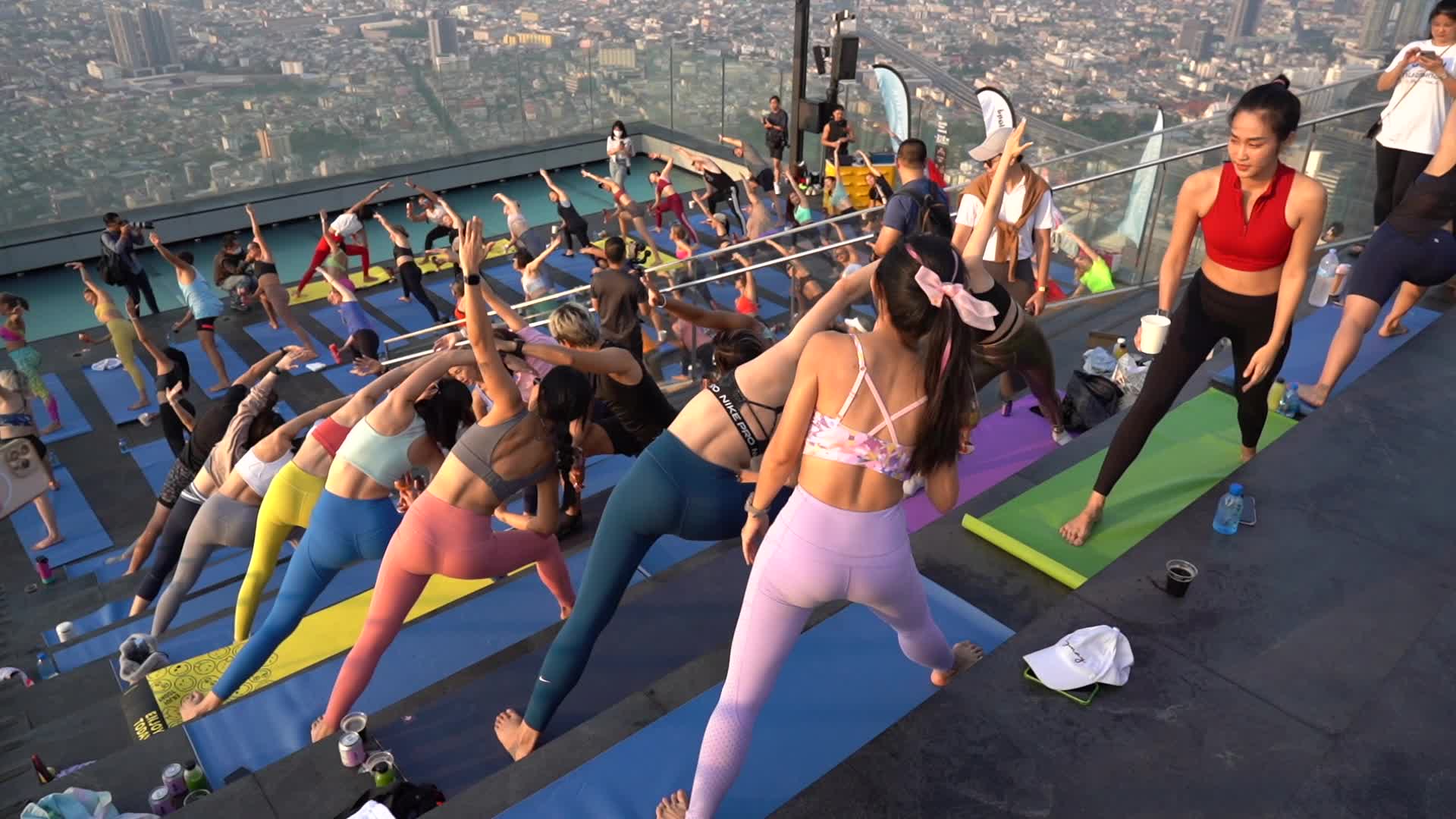 Wine Yoga Exercise on a Skyscraper in Bangkok.