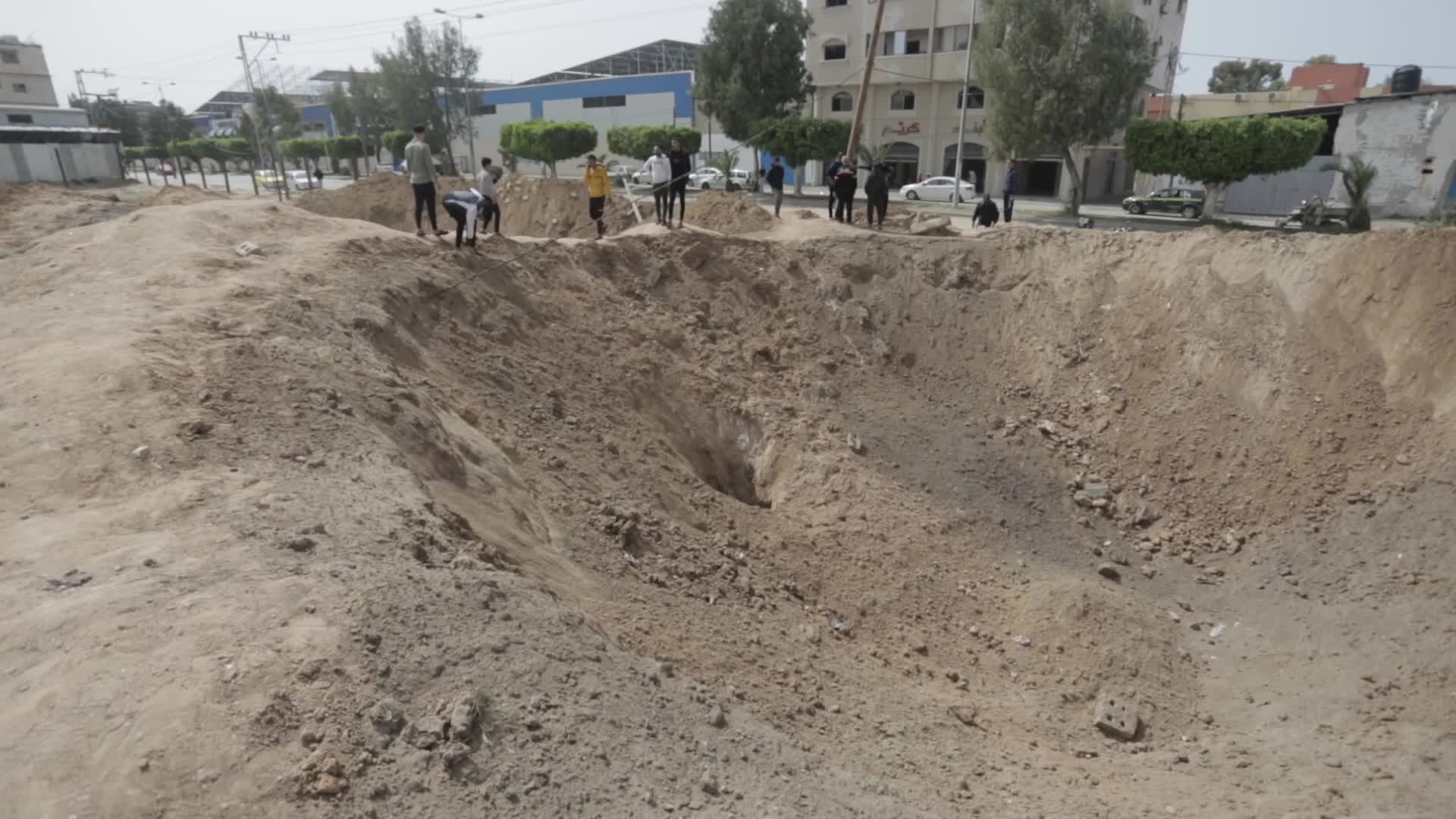 Palestinians inspect damage after air strikes in Gaza
