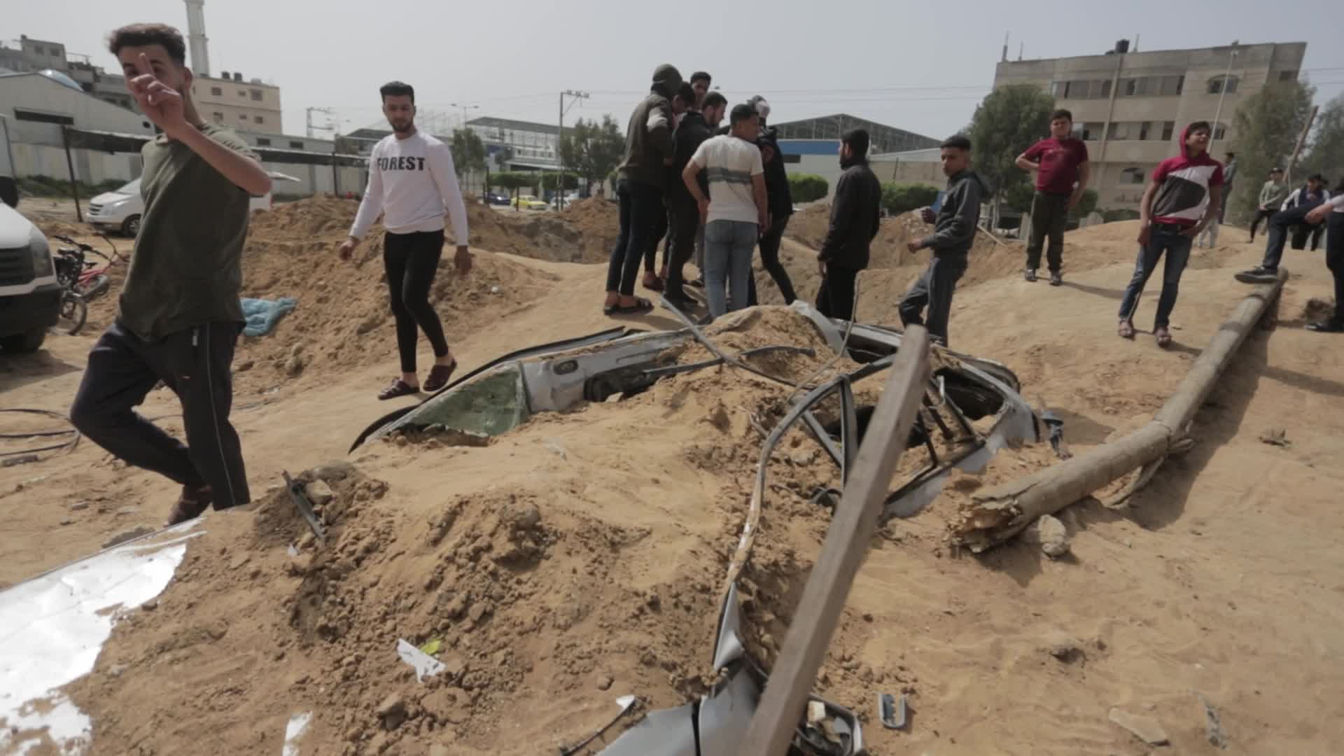 Palestinians inspect damage after air strikes in Gaza