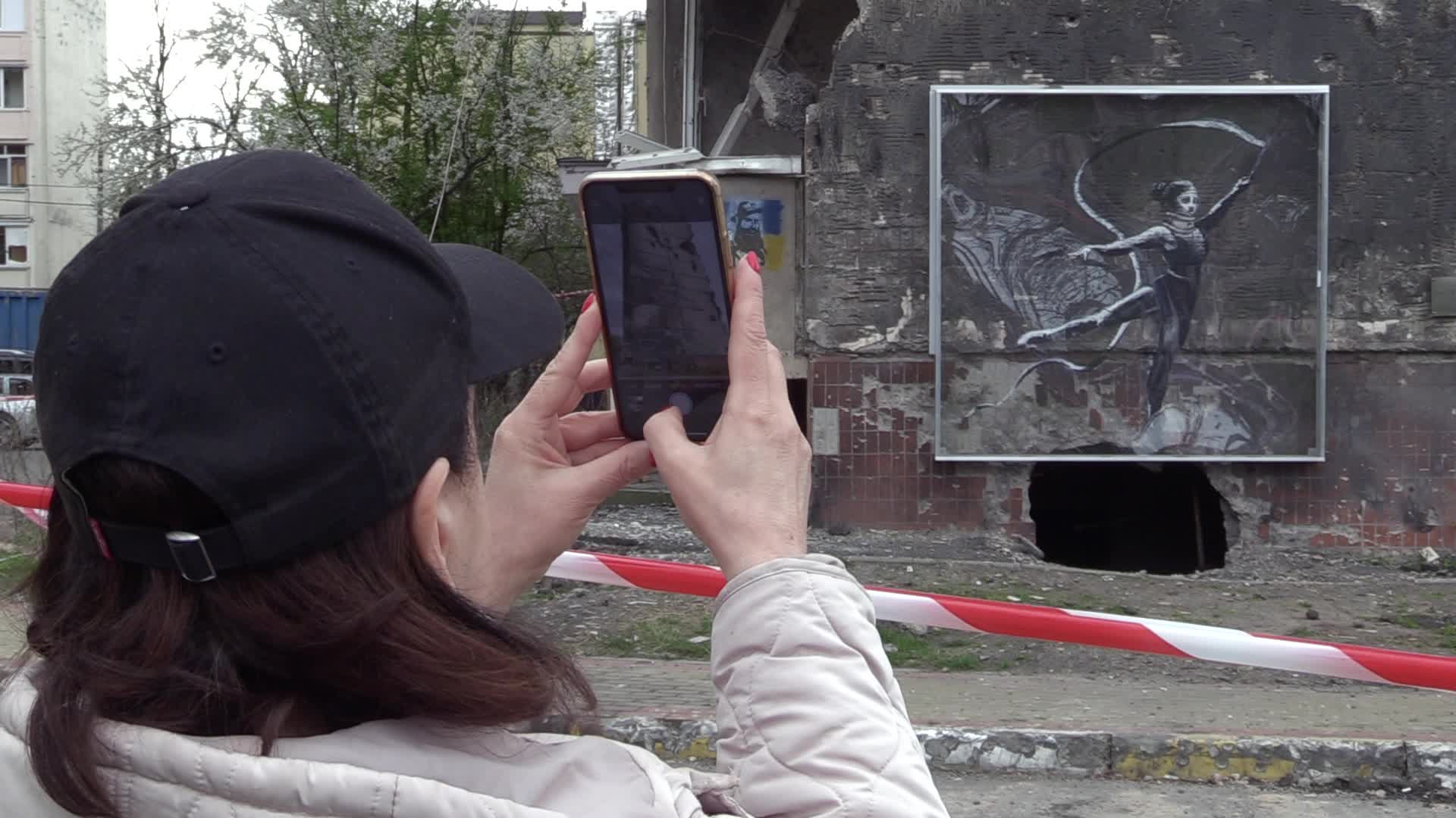 Graffiti by British street artist Banksy to be preserved as demolition of buildings damaged during the war begins in Irpin, amid Russia's invasion of Ukraine.