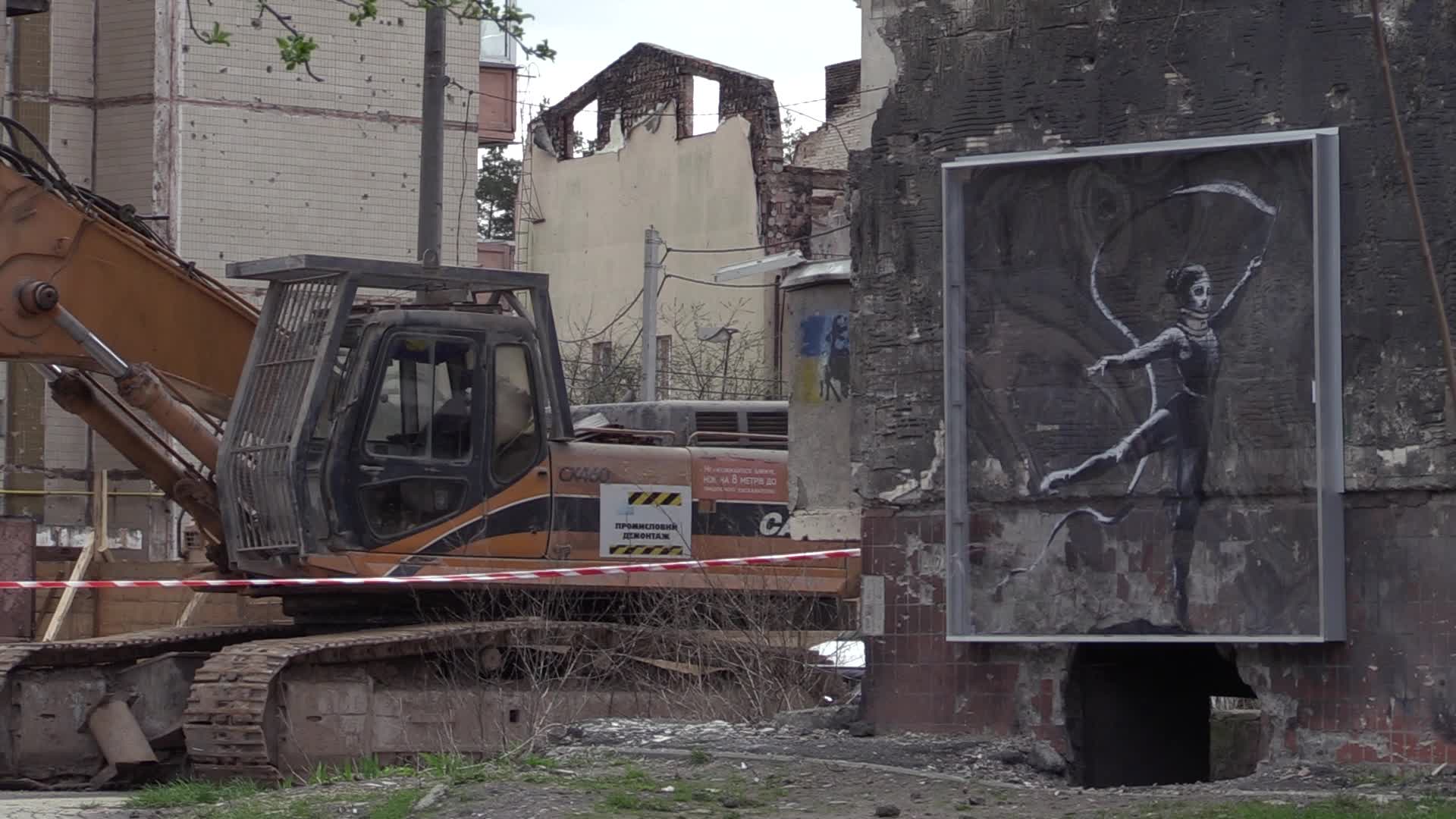 Graffiti by British street artist Banksy to be preserved as demolition of buildings damaged during the war begins in Irpin, amid Russia's invasion of Ukraine.