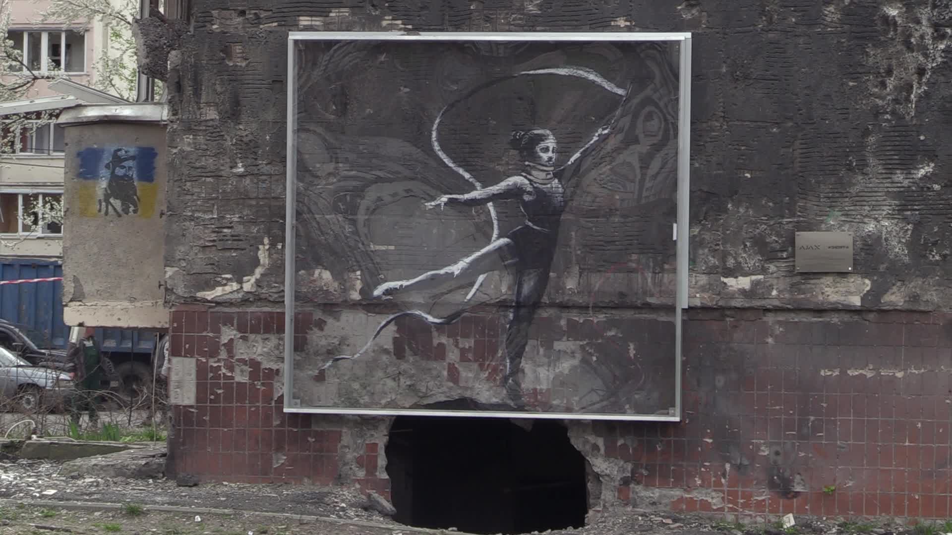 Graffiti by British street artist Banksy to be preserved as demolition of buildings damaged during the war begins in Irpin, amid Russia's invasion of Ukraine.
