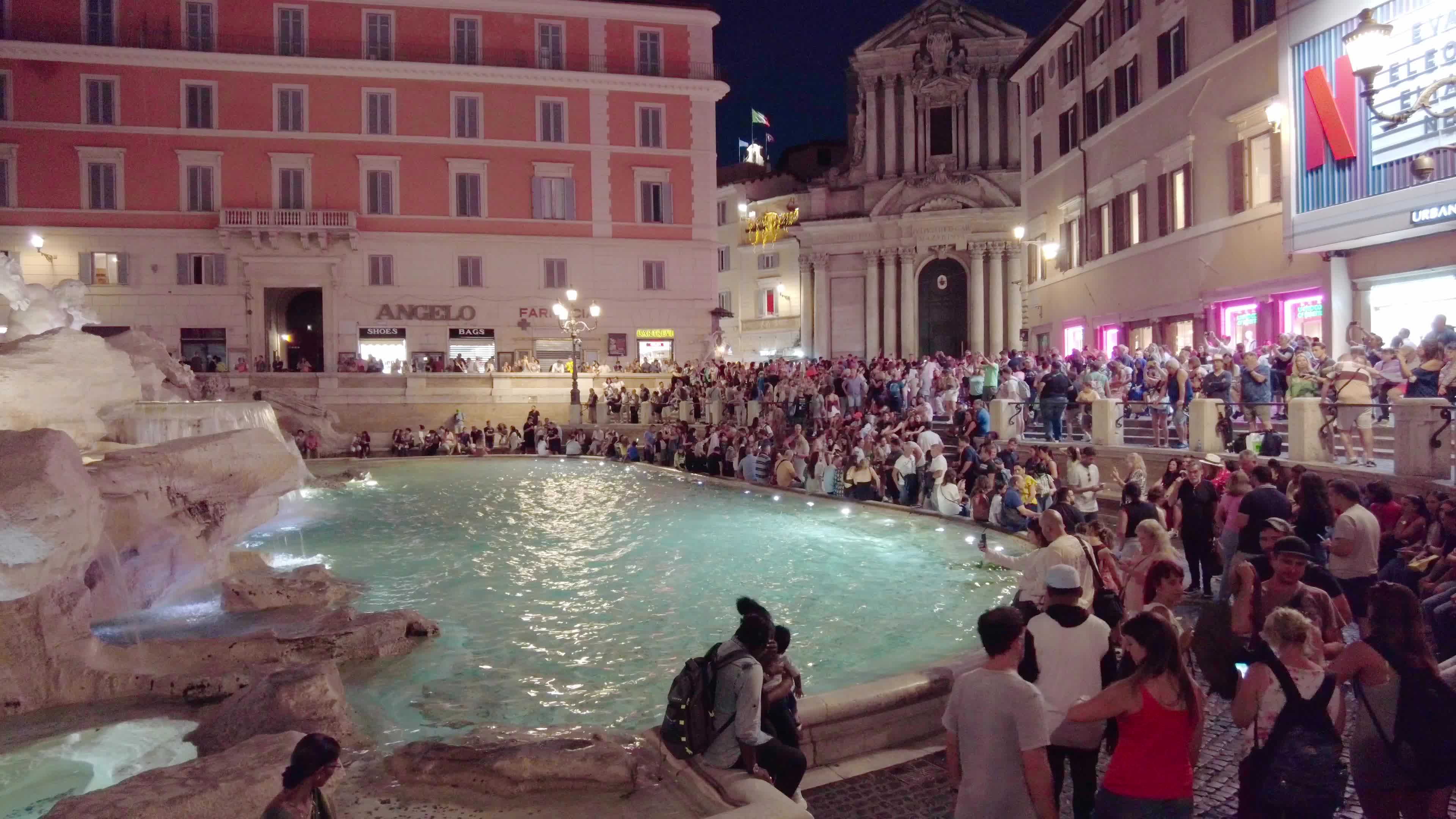 Trevi Fountains With Tourists In Rome, Italy