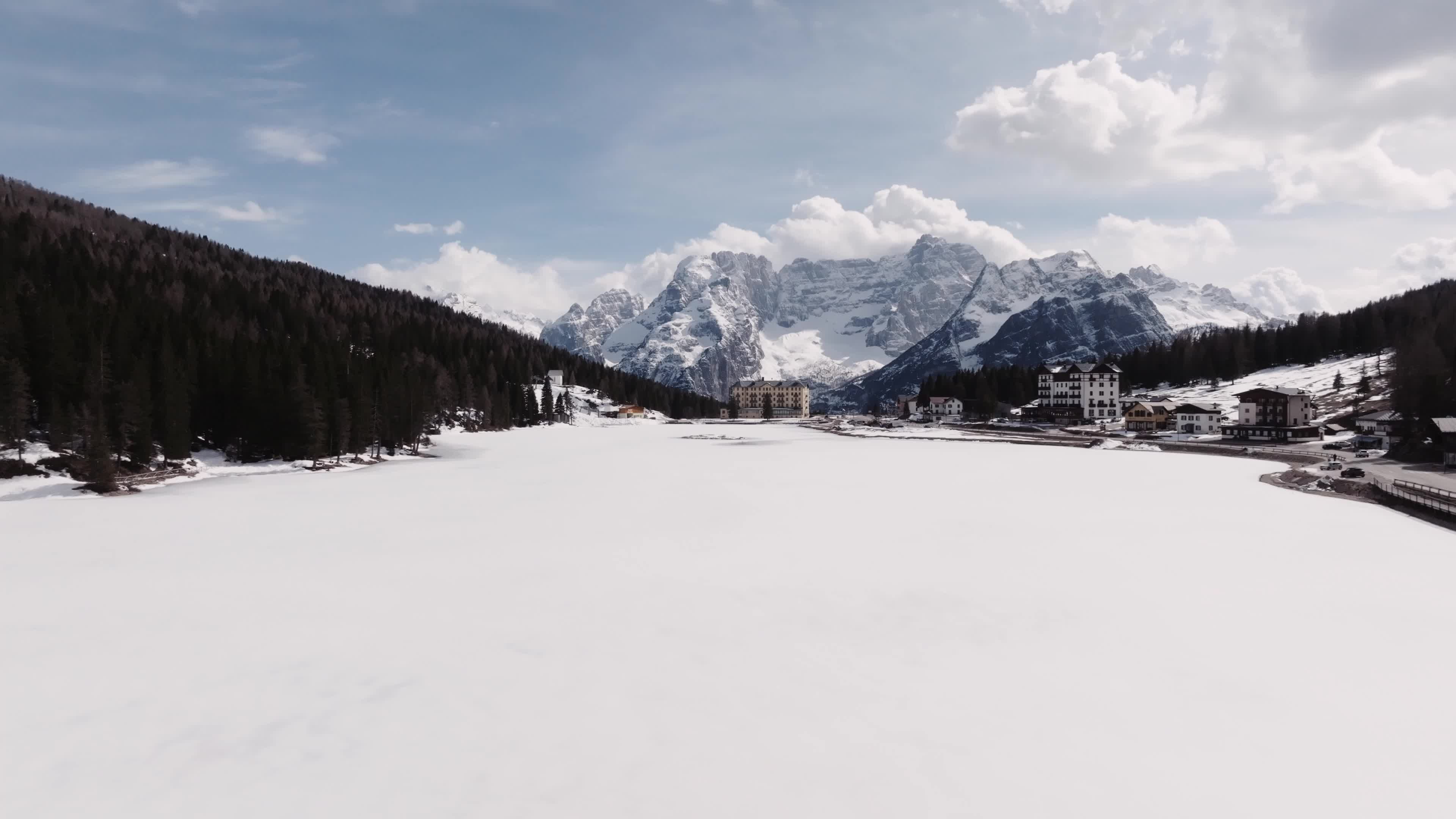 Drone View of Frozen Lake Misurina Covered in Snow
