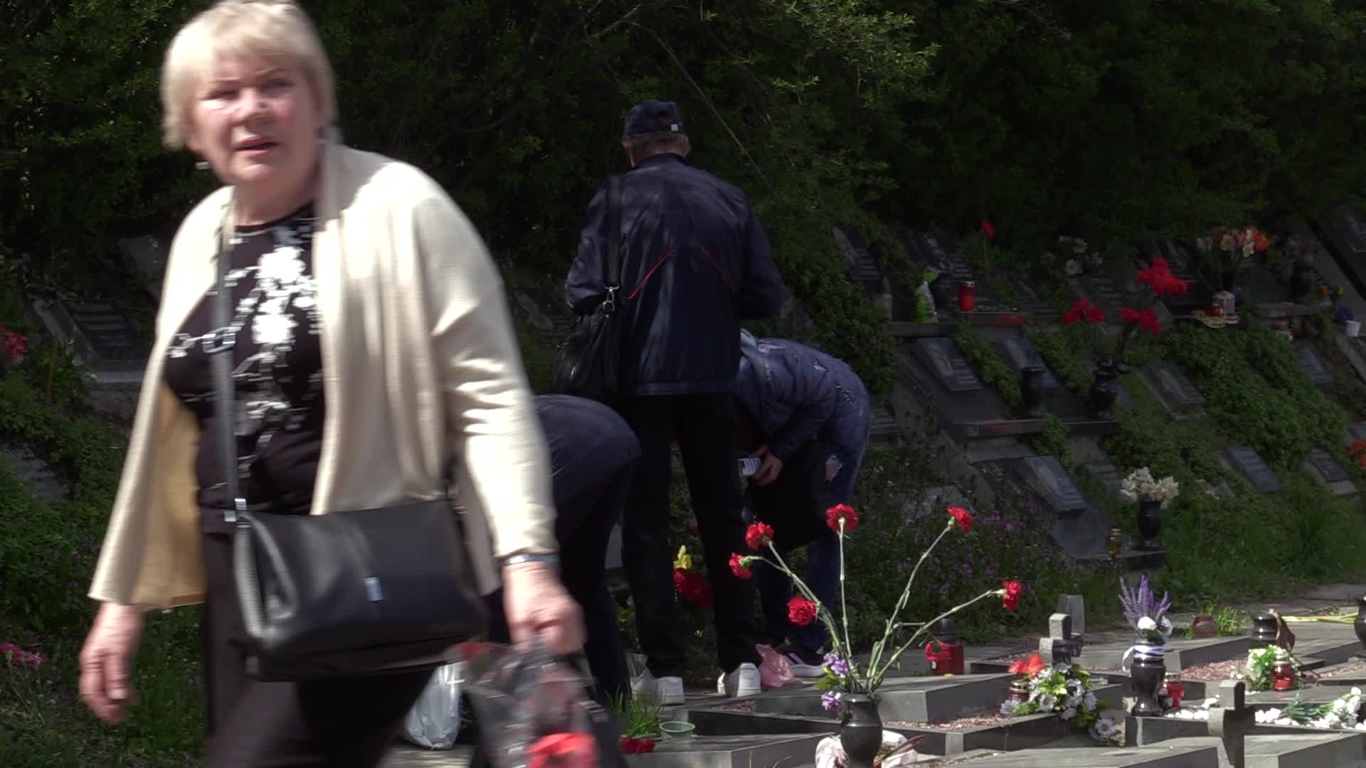 Ukrainians visit to graves of their deceased relatives during the memorial days in Kyiv, amid Russian invasion of Ukraine.