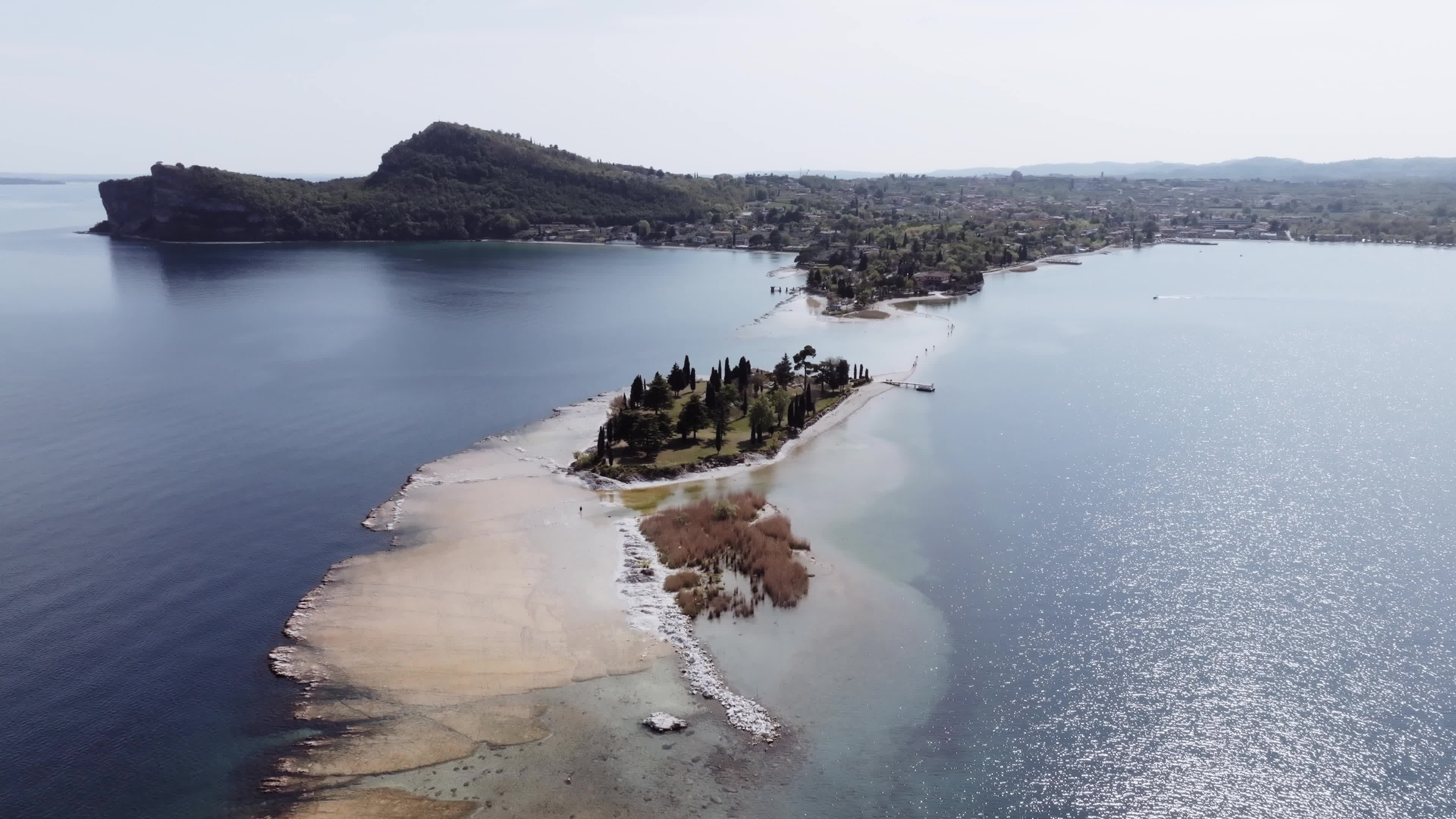 Drone View: Tourists Flock to Lake Garda Island, Reconnected Due to Drought