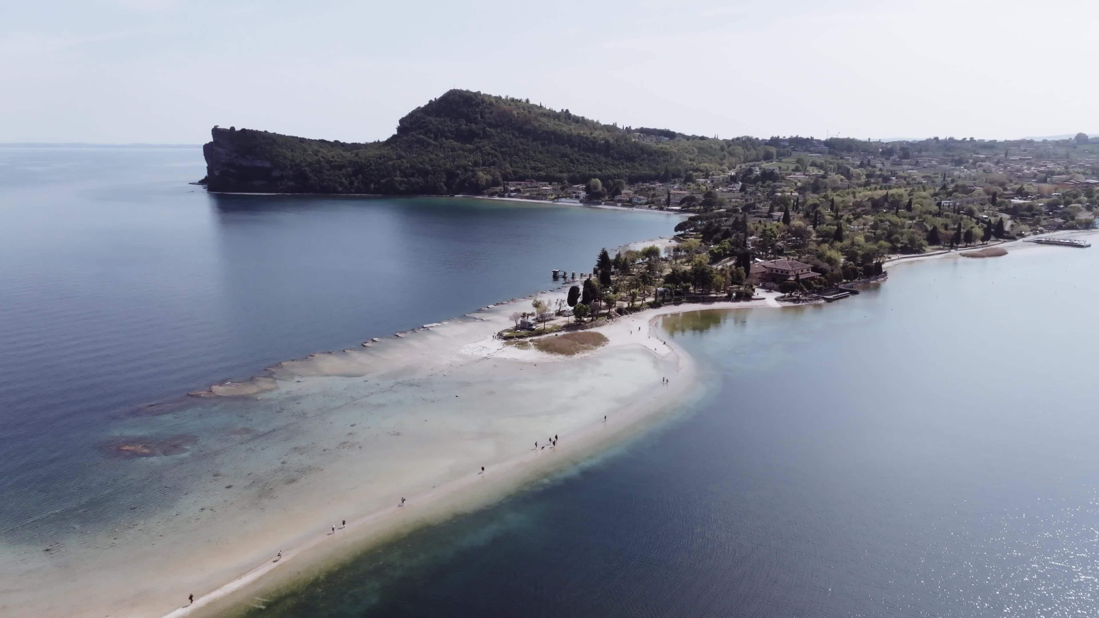 Drone View: Tourists Flock to Lake Garda Island, Reconnected Due to Drought