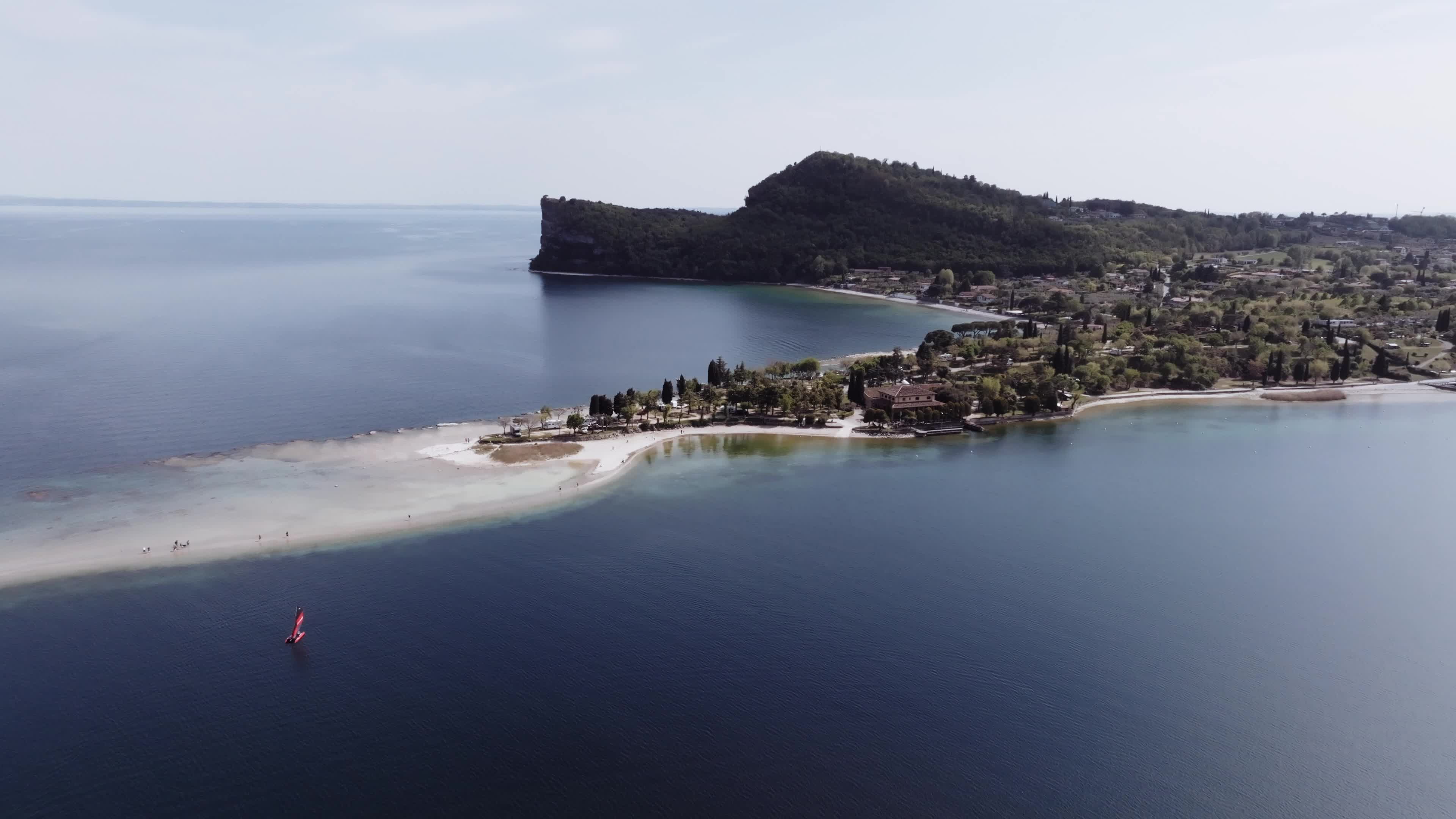 Drone View: Tourists Flock to Lake Garda Island, Reconnected Due to Drought