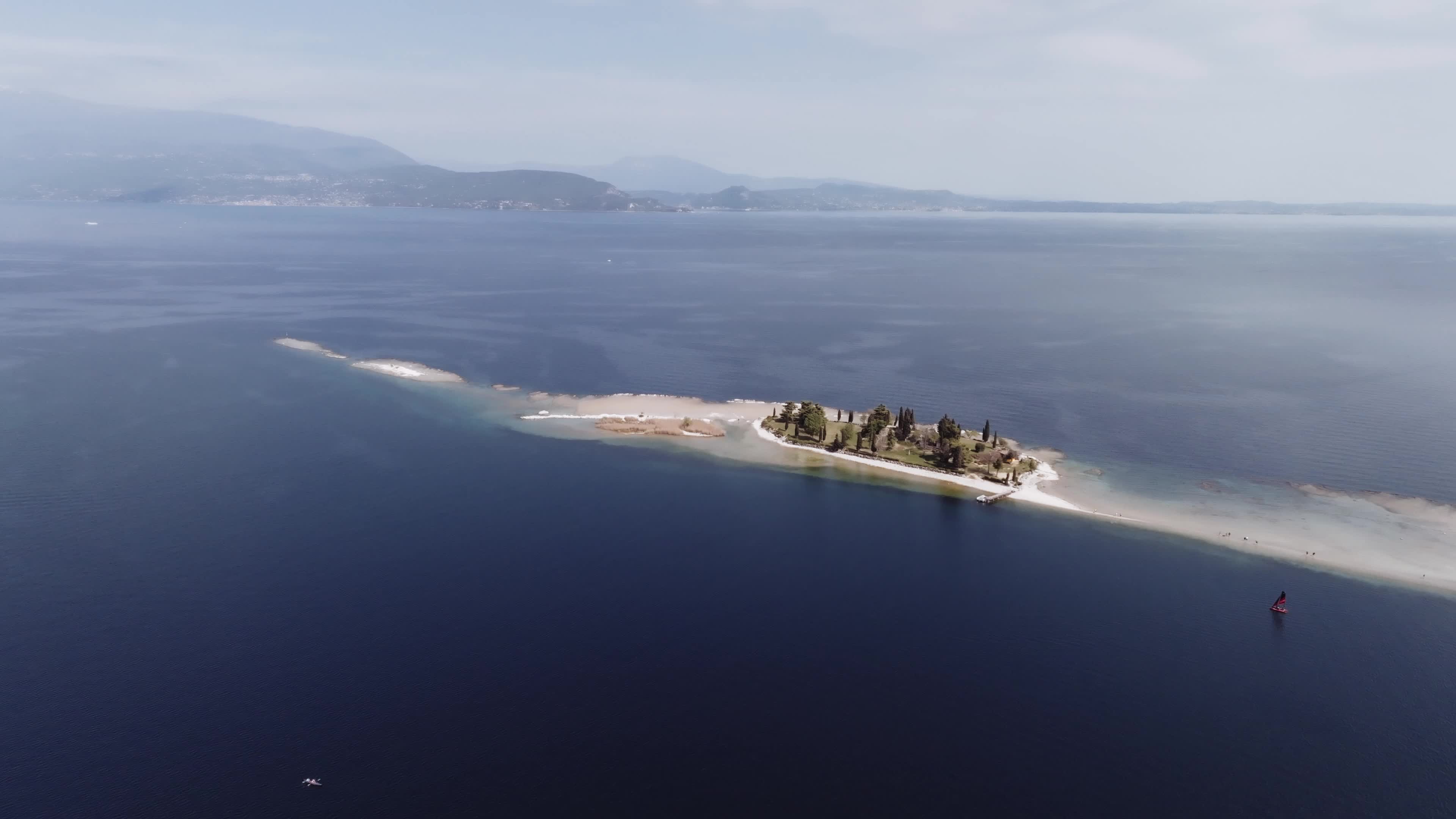 Drone View: Tourists Flock to Lake Garda Island, Reconnected Due to Drought