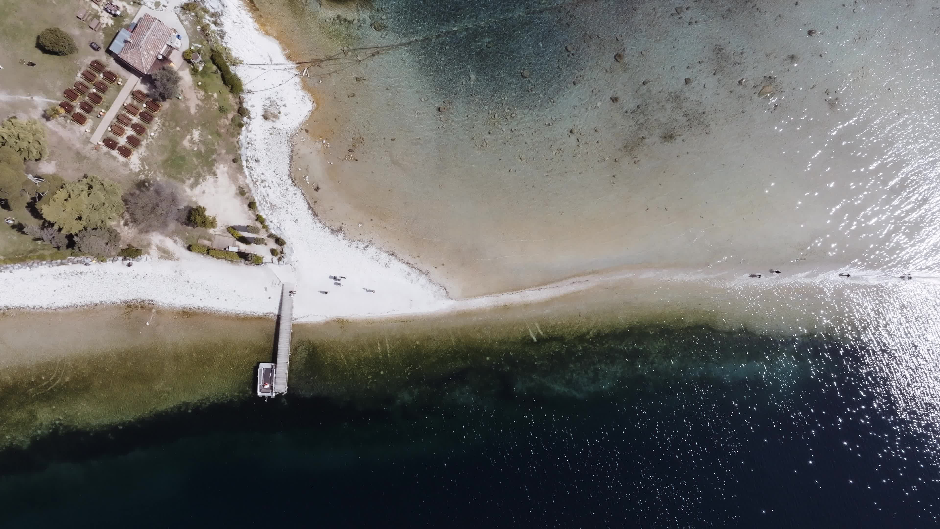 Drone View: Tourists Flock to Lake Garda Island, Reconnected Due to Drought