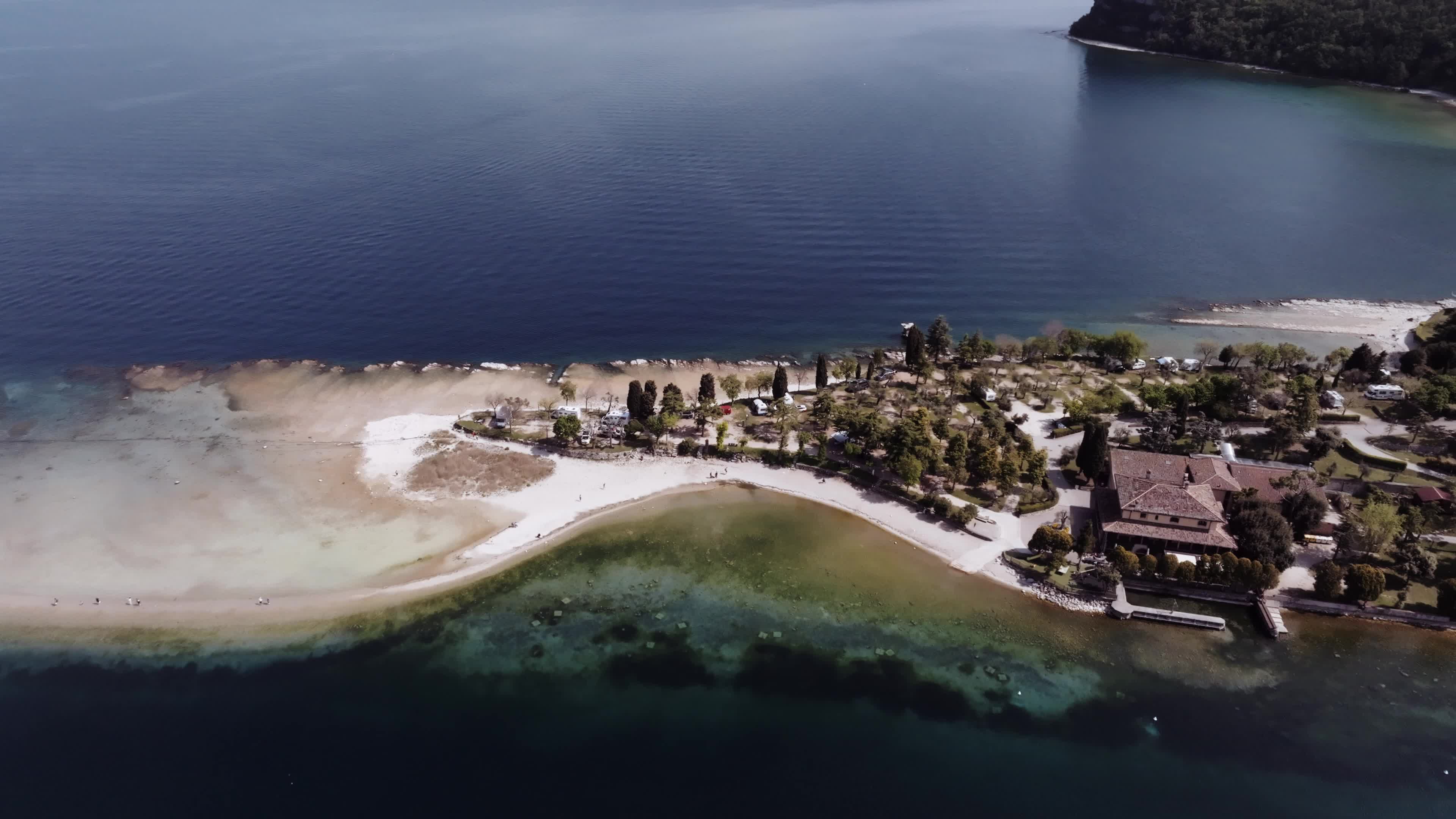 Drone View: Tourists Flock to Lake Garda Island, Reconnected Due to Drought