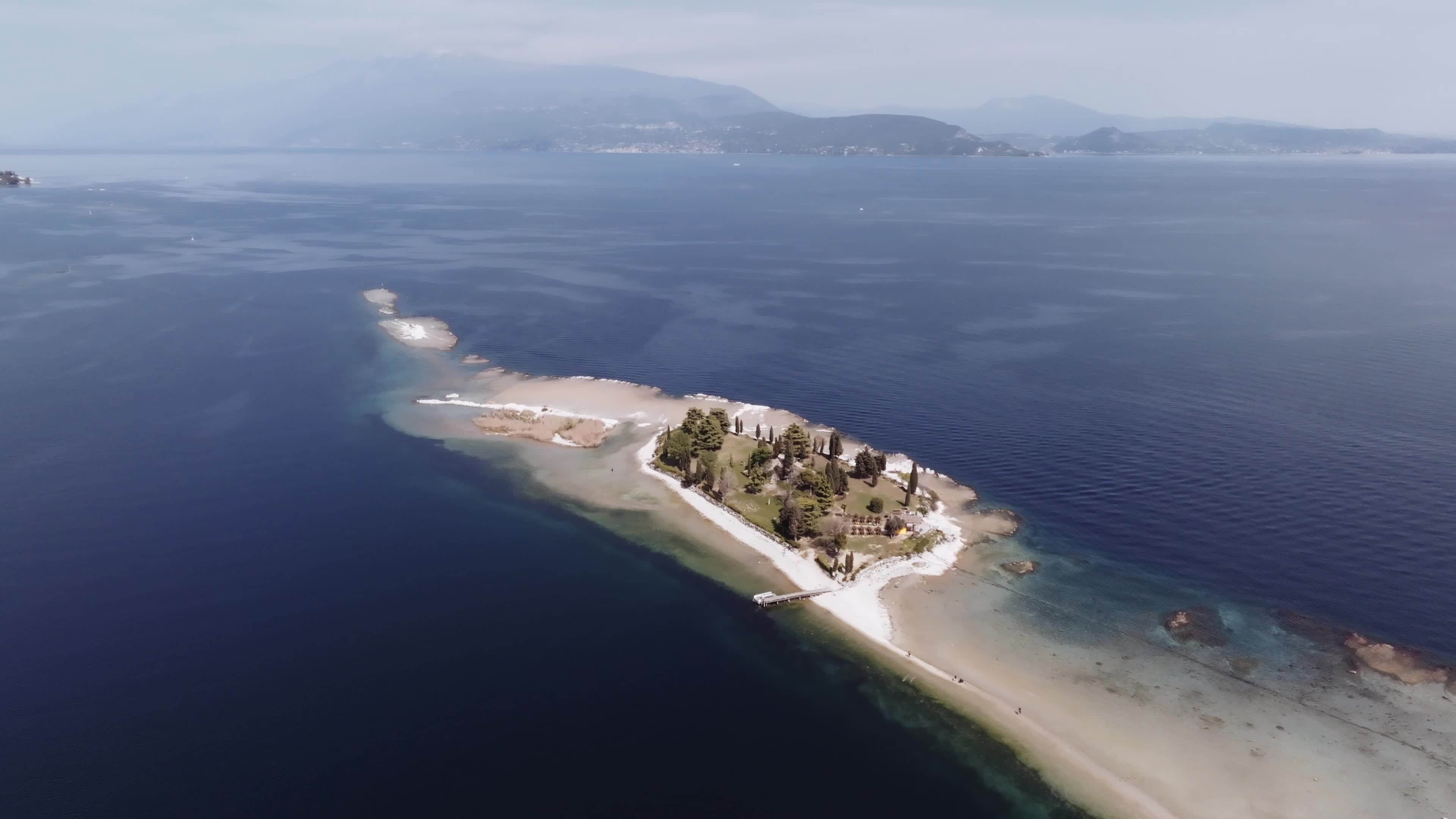 Drone View: Tourists Flock to Lake Garda Island, Reconnected Due to Drought