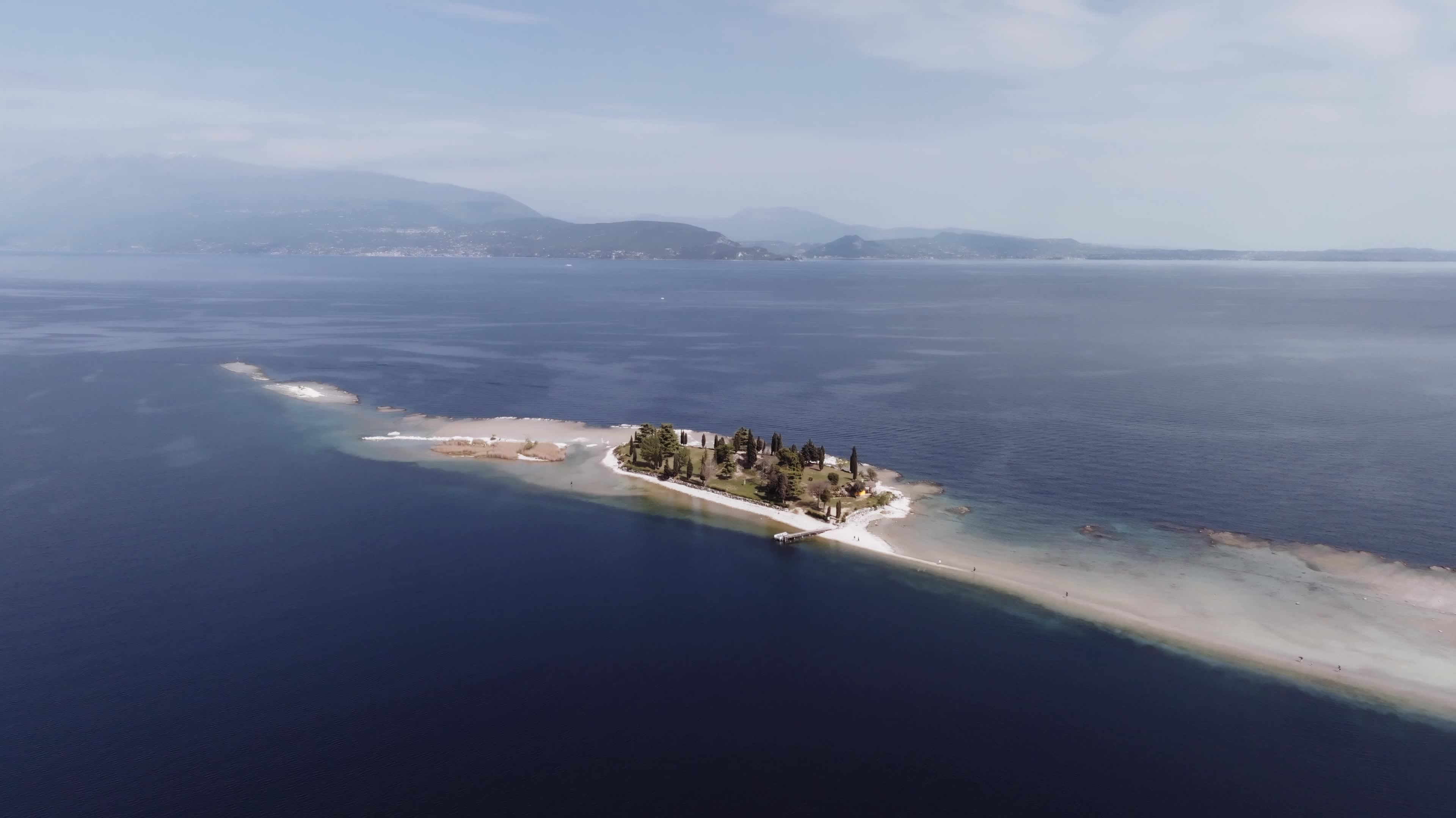 Drone View: Tourists Flock to Lake Garda Island, Reconnected Due to Drought