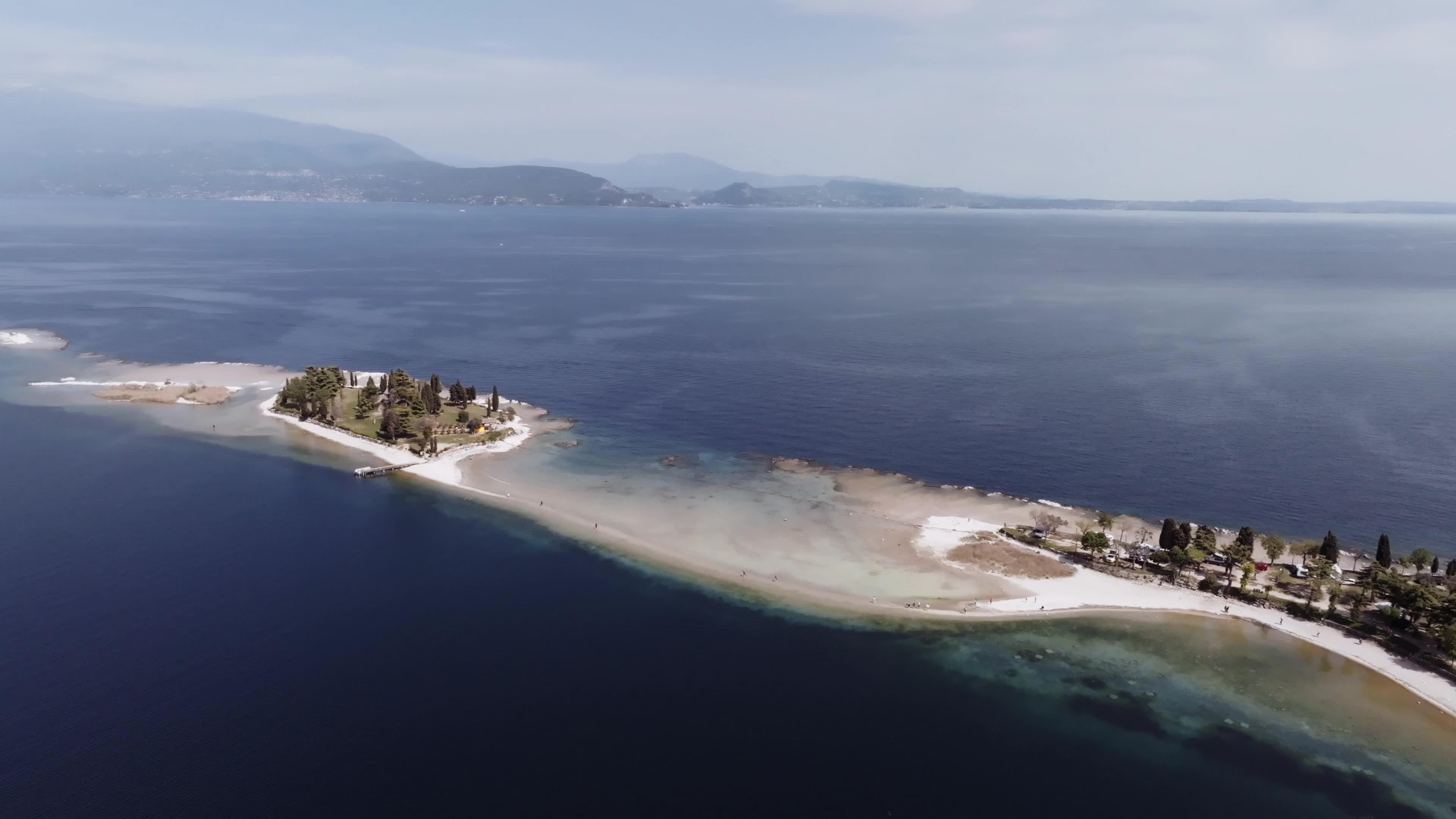 Drone View: Tourists Flock to Lake Garda Island, Reconnected Due to Drought