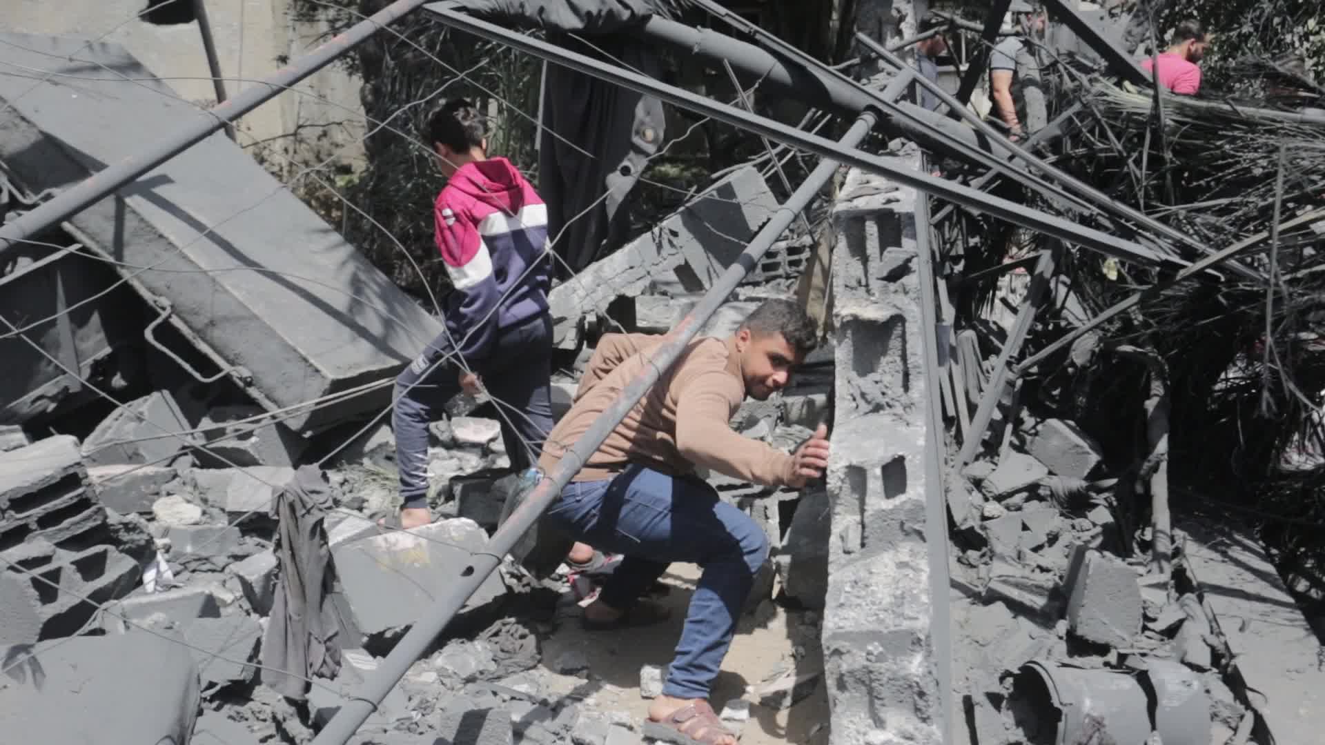 Palestinians inspect damage following Israeli air strikes