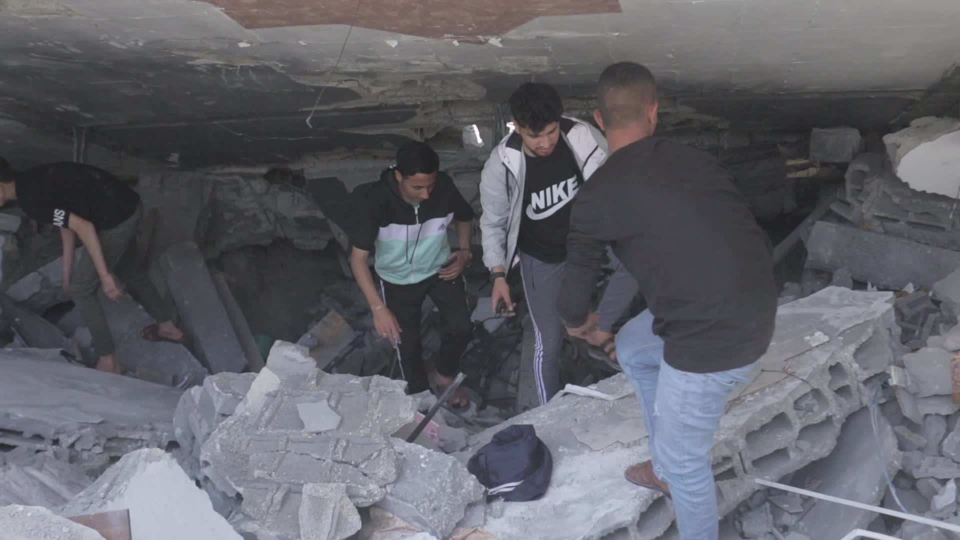 Palestinians inspect damage following Israeli air strikes