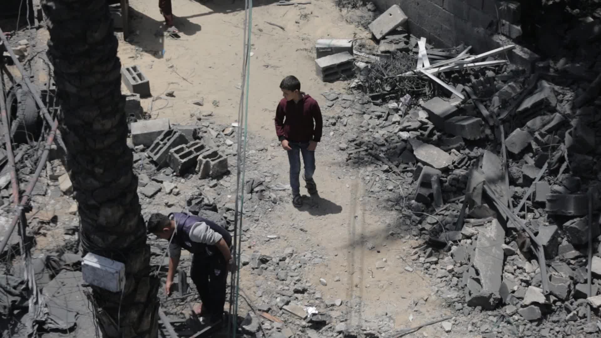 Palestinians inspect damage following Israeli air strikes