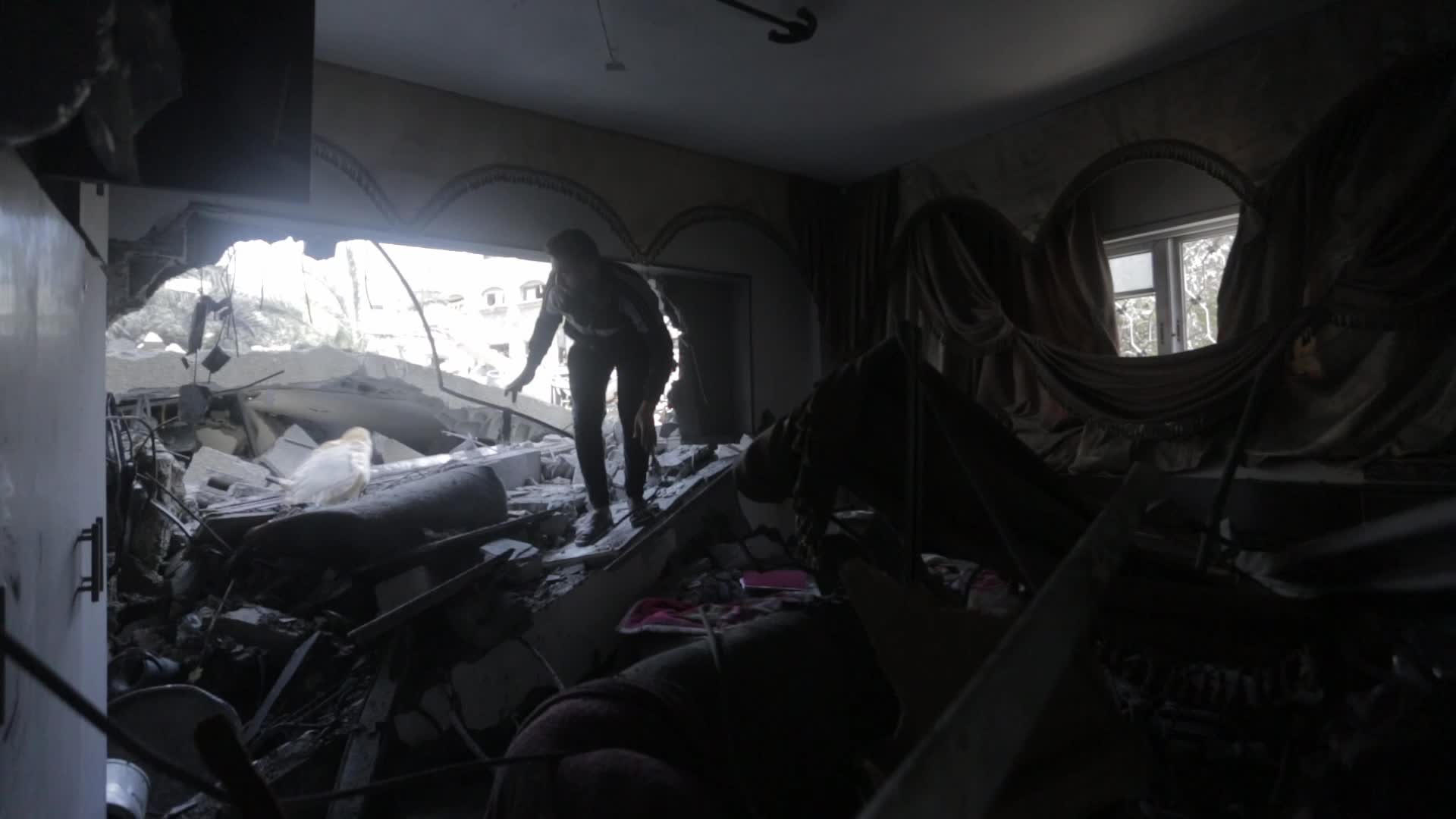 Palestinians inspect damage following Israeli air strikes